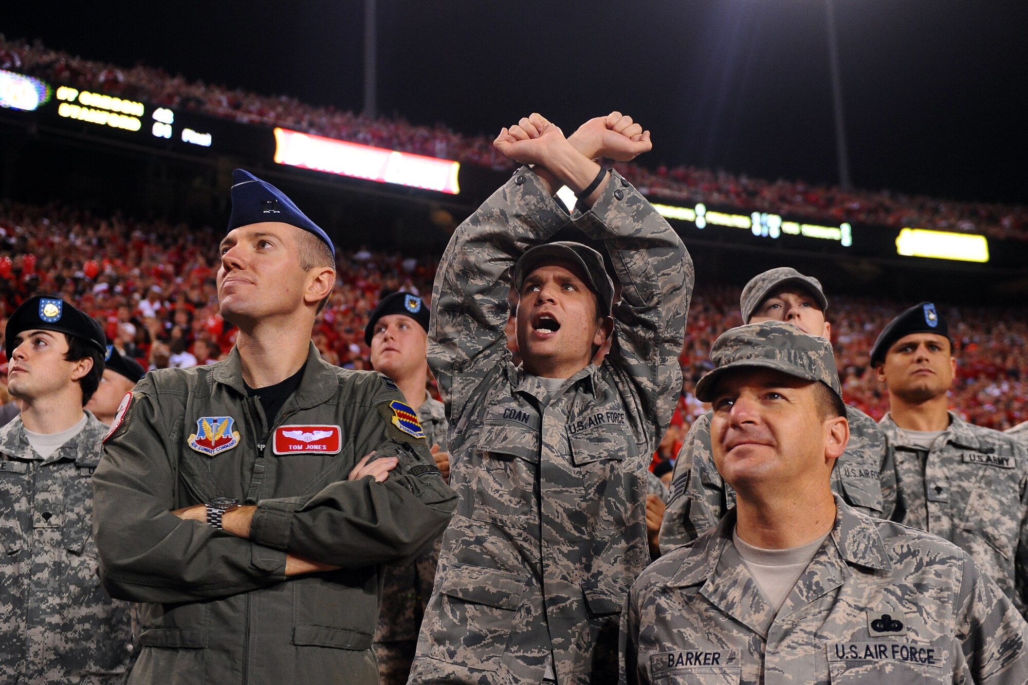 OFFUTT AIR FORCE BASE, Neb. ? Staff Sgt. Tom Coan, with the 55th Maintenance Squadron, throws up his arms as the University of Nebraska Cornhuskers make a defensive play against the Oklahoma Sooners during the university's military appreciation game at Memorial Stadium in Lincoln, Neb. Nov. 7.   The University invited members of the military to attend the game to thank them for their service. U.S. Air Force Photo by Josh Plueger
