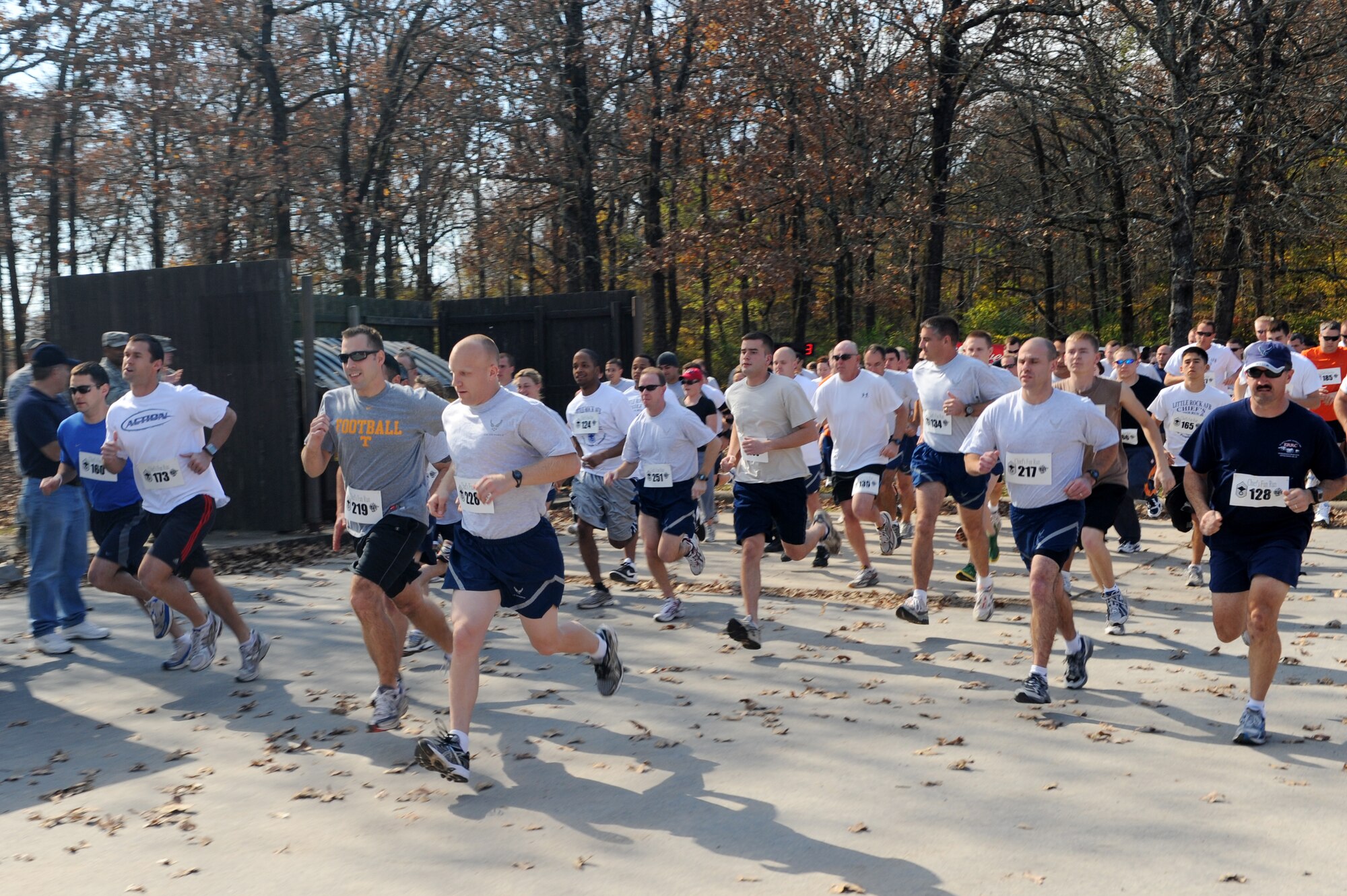 Little Rock Air Force Base Airmen take off from the starting line of the Chief's Group Fun Run on base Nov. 6. Donations from the event contribute toward future scholarship awards. (US Air Force photo by Senior Airman Jim Araos)