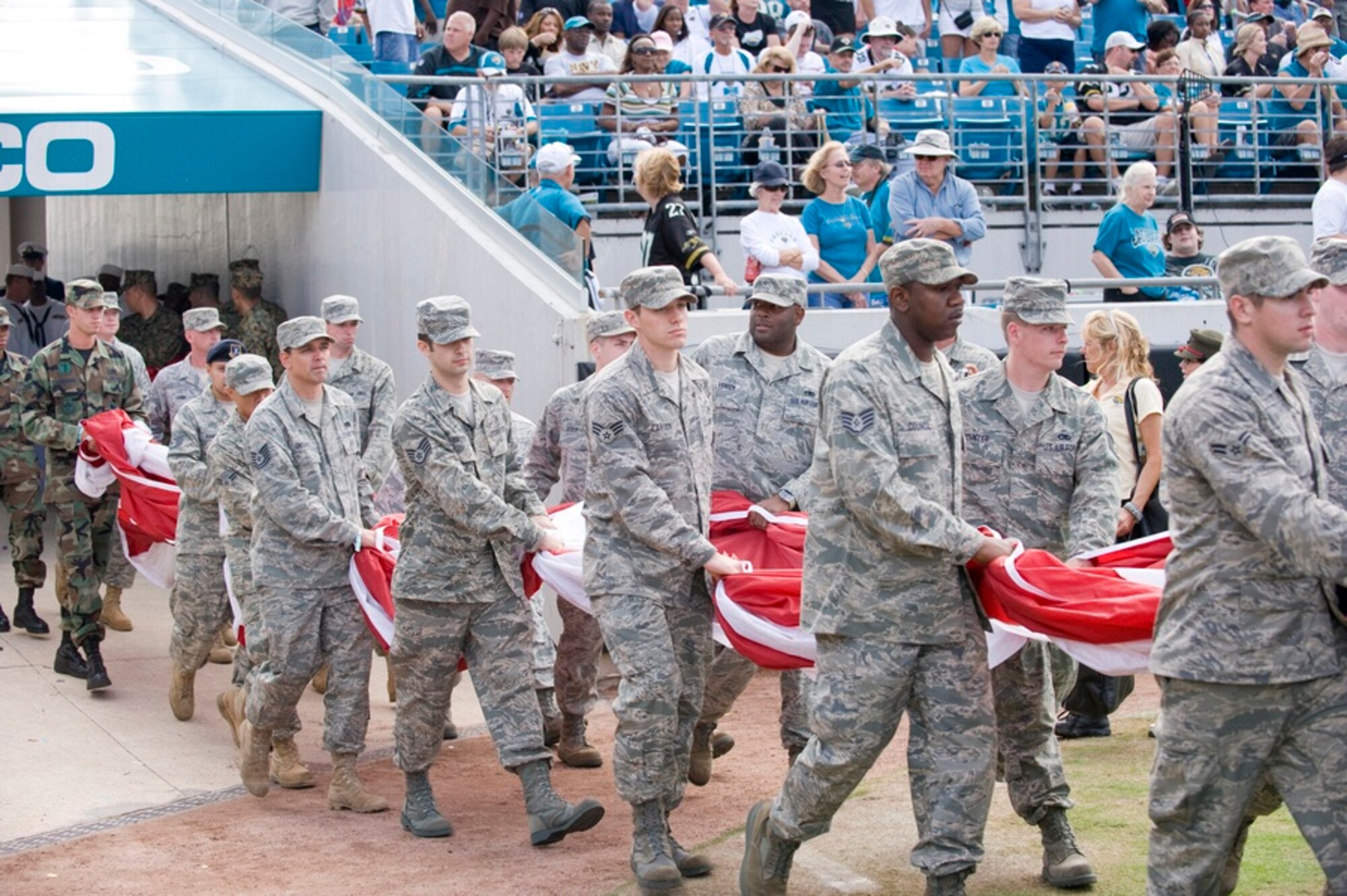 Tyndall Airmen carry the American flag onto the field during a Military Appreciation Day half time performance at the Jacksonville Jaguars versus Kansas City Chiefs game in Jacksonville Municipal Stadium Nov. 8. (U.S. Air Force photo by Jonathan Gibson)
