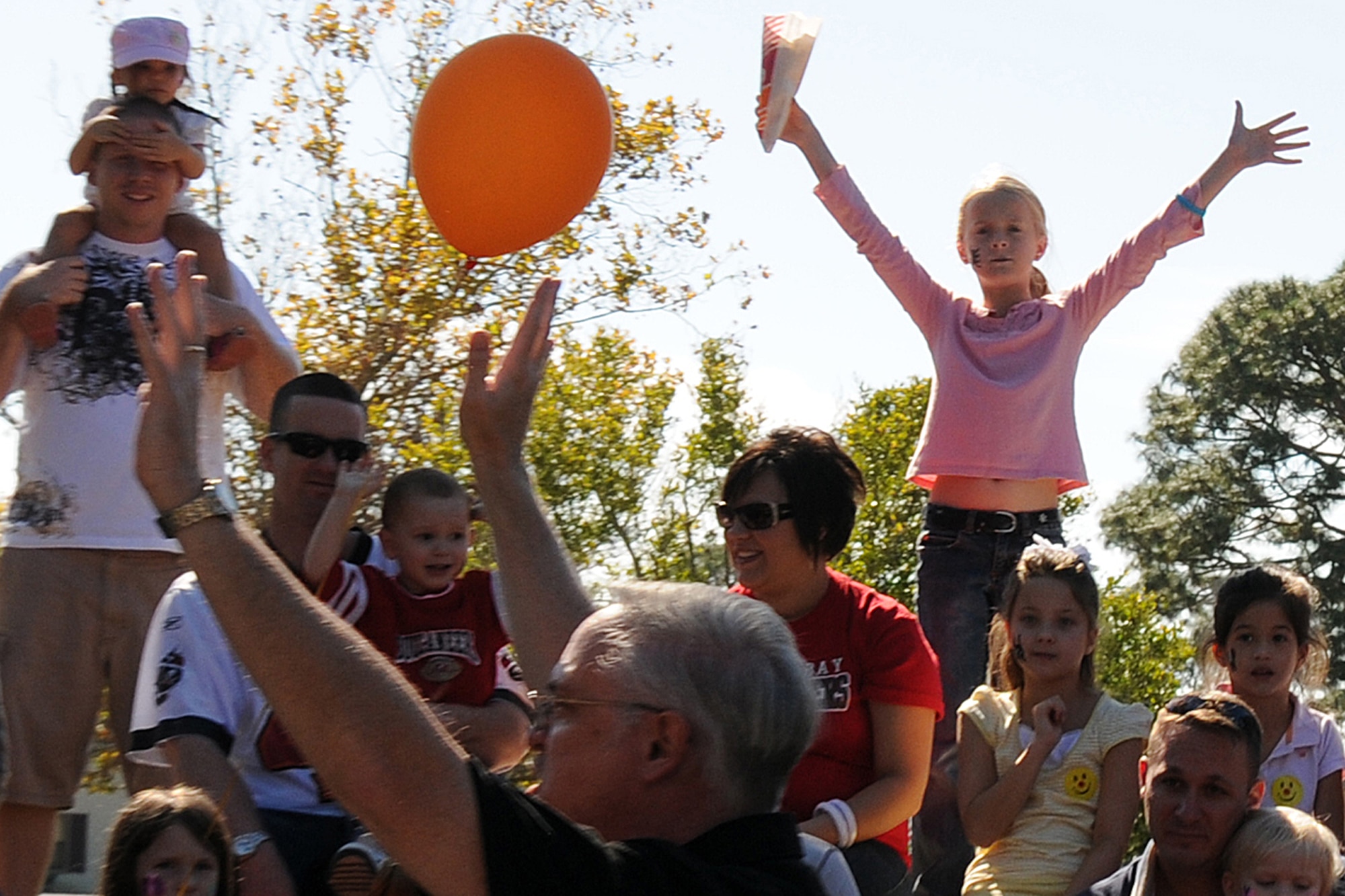 EGLIN AIR FORCE BASE, Fla. -- Children play Simon Says during a magic show at the Fall Festival at Unity Park Nov. 7, during the Week of the Air Force Family. The Team Eglin community picnic showcased base helping agencies with information booths and activities like clowns, face painting, magic shows, bouncy castle, free food and demos.  (U.S. Air Force photo/Airman 1st Class Anthony Jennings)