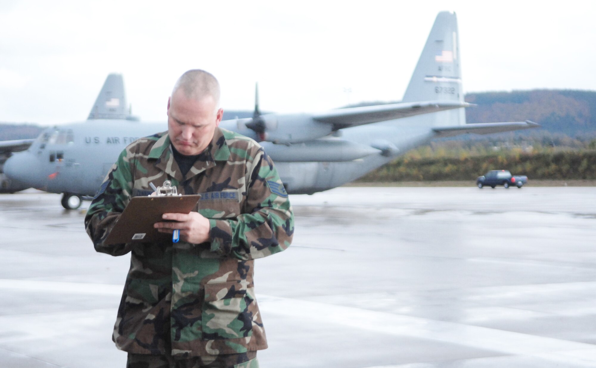 Staff Sgt. Edward Cunningham completes a vehicle checkout form Nov. 4, 2009, at Ramstein Air Base, Germany. Sergeant Cunningham is a reservist serving a deployment here with the 38th Expeditionary Airlift Squadron. (U.S. Air Force photo/Tech. Sgt. Michael Voss)