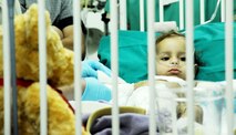 An Iraqi child recovering from third-degree burns lies in a crib at the Air Force Theater Hospital Oct. 30, 2009, at Joint Base Balad, Iraq. Airmen of the 332nd Expeditionary Medical Operations Squadron provided treatment for her injuries, suffered in a household accident. (U.S. Air Force photo/Senior Airman Christopher Hubenthal) 
