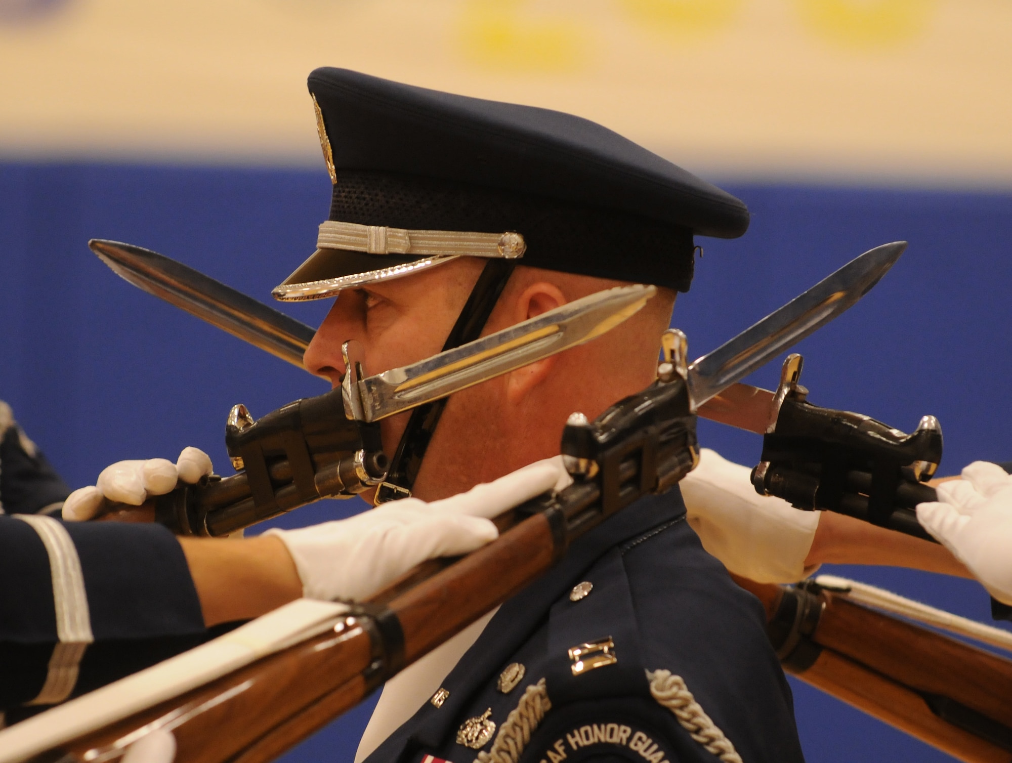 Capt. Michael Fanton, United States Air Force Honor Guard Drill Team commander remains completely focused and still with the bayonets of four M-1 Garand rifles surrounding him during a four-man drill performance for students at Randolph Air Force Base, Texas Nov. 2.  The Drill Team tours worldwide representing all Airmen while showcasing Air Force precision and professionalism and personifying the integrity, discipline, and teamwork of every Airman and every Air Force mission. During the Air Force Honor Guard's 60-year history, their traveling component, the Drill Team, has performed in every state of the union and many countries abroad. (U.S. Air Force photo by Senior Airman Sean Adams)