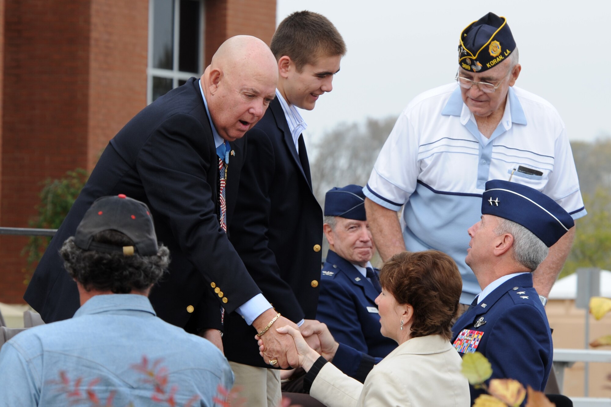 Maj. Gen. Floyd L. Carpenter, 8th Air Force, commander, and his wife Melissa, greet Medal of Honor recipient, U.S. Army Command Sgt. Maj. Gary Littrell, and his grandson before the Veteran’s Day Parade at the Bossier Parish Community College campus November 7, 2009. Hundreds of Airmen from Barksdale AFB, La., participated in and attended the parade, which celebrated America’s veterans. A B-52 Stratofortress from the 93rd Bomb Squadron amazed the crowd with a flyover during the parade. (U.S. Air Force photo/Tech. Sgt. Jeff Walston)