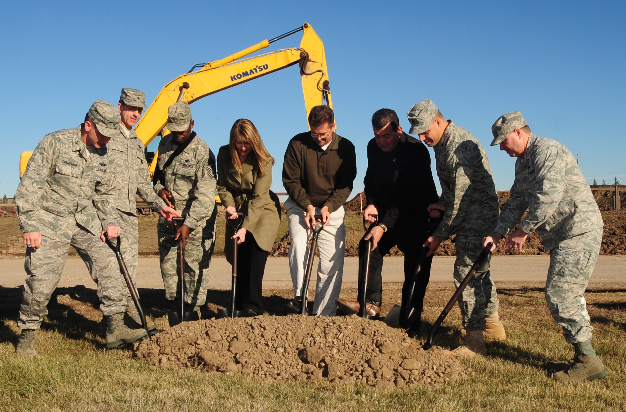 ELLSWORTH AFB S.D. -- (Left to right) Col. Jeffrey Taliaferro, 28th Bomb Wing commander, Col. Steven Hiss, 28 BW vice commander, Chief Master Sgt Clifton Cole, 28 BW command chief, Ms. Tania Schepper, representing Congresswoman Herseth Sandlin, Mr. Darrell Shoemaker, representing Senator Johnson, Mr. Qusi Al`Haj, representing Senator Thune, Lt. Col. Matthew Joganich, 28th Civil Engineer Squadron commander and Col. Michael Yuill, 28th Mission Support Group commander, kick off the new gate ground breaking by kicking in their shovels, Nov. 5.  The new gate will replace the Patriot Gate. (U.S. Air Force photo/Airman 1st Class Anthony Sanchelli)
