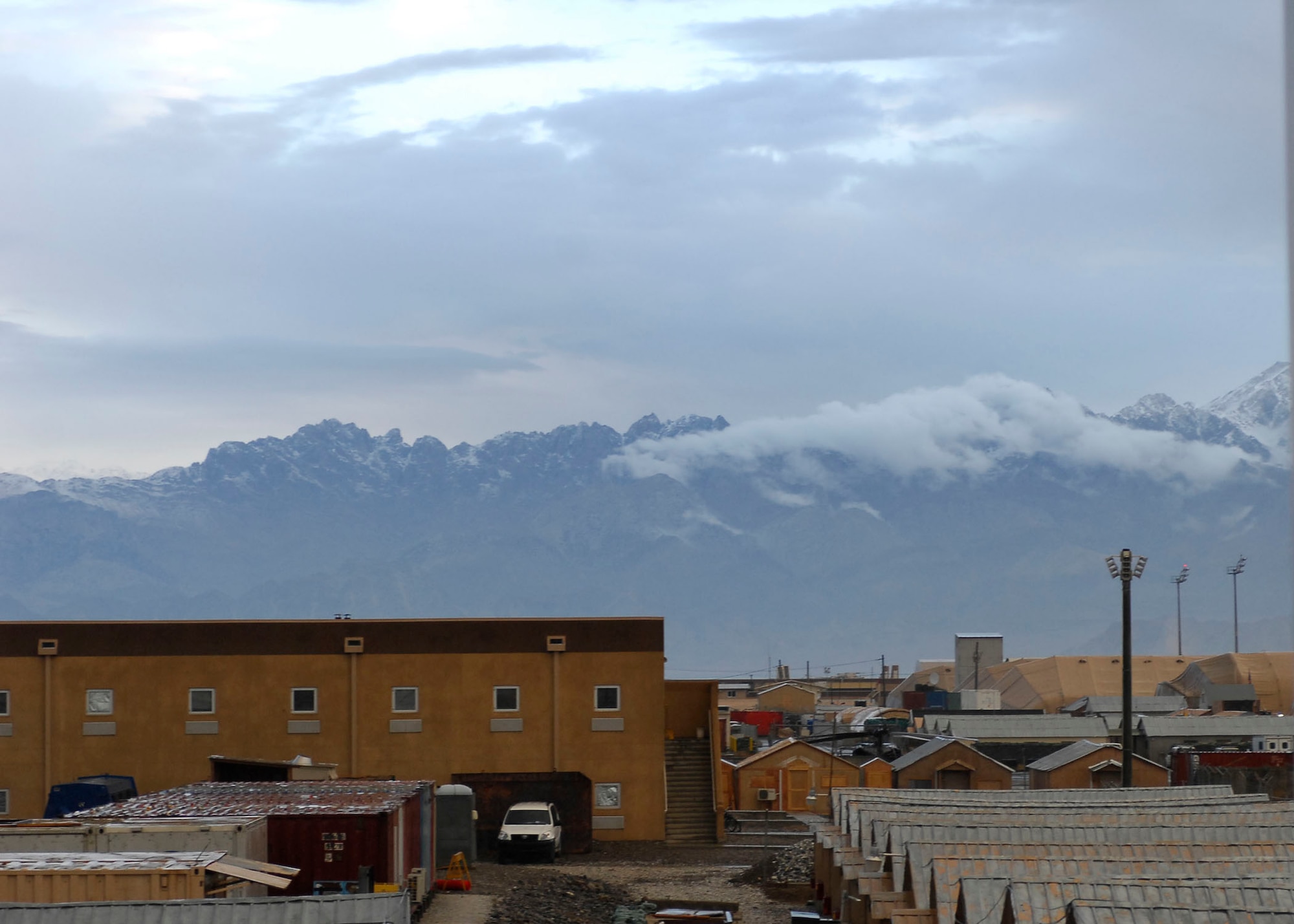 BAGRAM AIRFIELD, Afghanistan -- Mountains in Afghanistan are barely visible in the morning haze Nov. 9, 2009.  The high altitude of the Hindu Kush mountain range creates a harsh climate ranging from more than 100 degrees Fahrenheit in the summer to below-freezing temperatures in the winter.  (U.S. Air Force photo/Senior Airman Felicia Juenke)