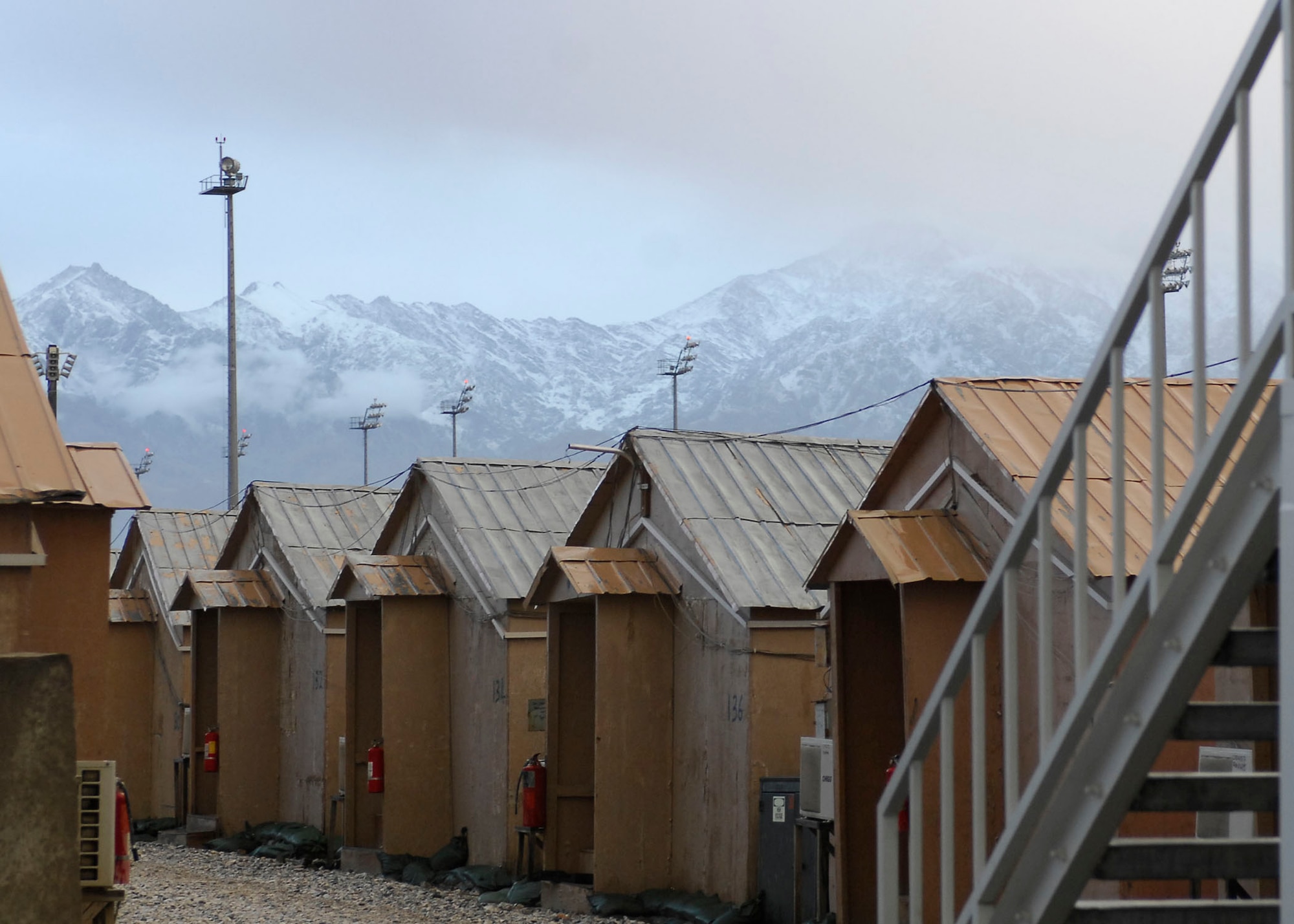 BAGRAM AIRFIELD, Afghanistan -- Mountains in Afghanistan hide in the morning haze Nov. 9, 2009.  The high altitude of the Hindu Kush mountain range creates a harsh climate ranging from more than 100 degrees Fahrenheit in the summer to below-freezing temperatures in the winter.  (U.S. Air Force photo/Senior Airman Felicia Juenke)