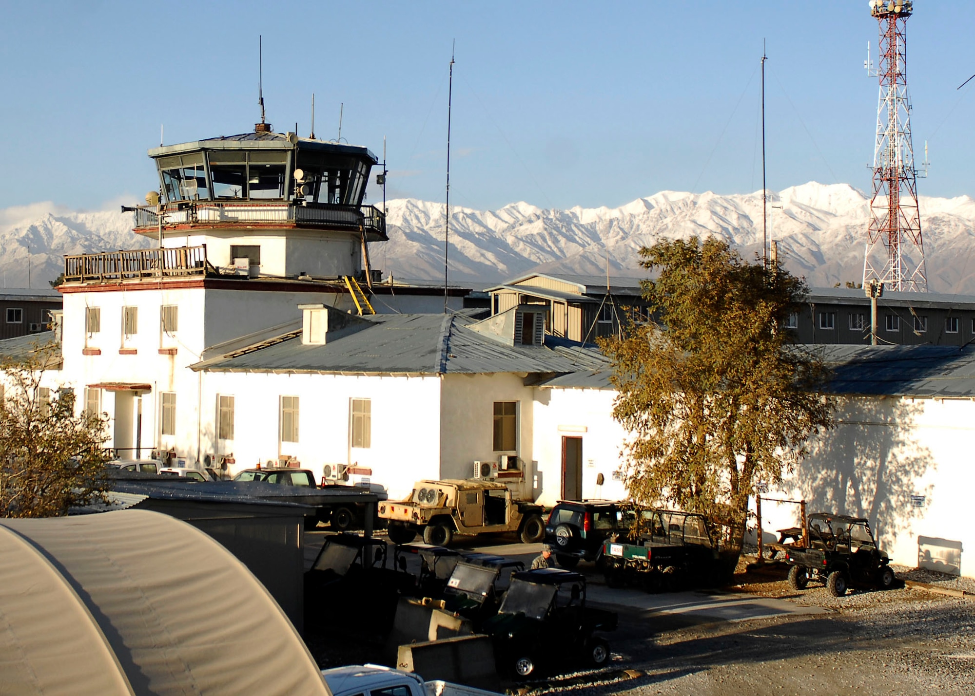 BAGRAM AIRFIELD, Afghanistan -- Beautiful mountains in Afghanistan are visible behind the old Russian Control Tower, known as the Crow?s Nest,   Nov. 9, 2009.  The Russian Control Tower was built in 1976 during the Soviet Union's occupation of the region.  Currently more than 5,000 Airmen are deployed to Bagram supporting Operation Enduring Freedom and NATO International Security Assistance Forces.  (U.S. Air Force photo/Senior Airman Felicia Juenke)