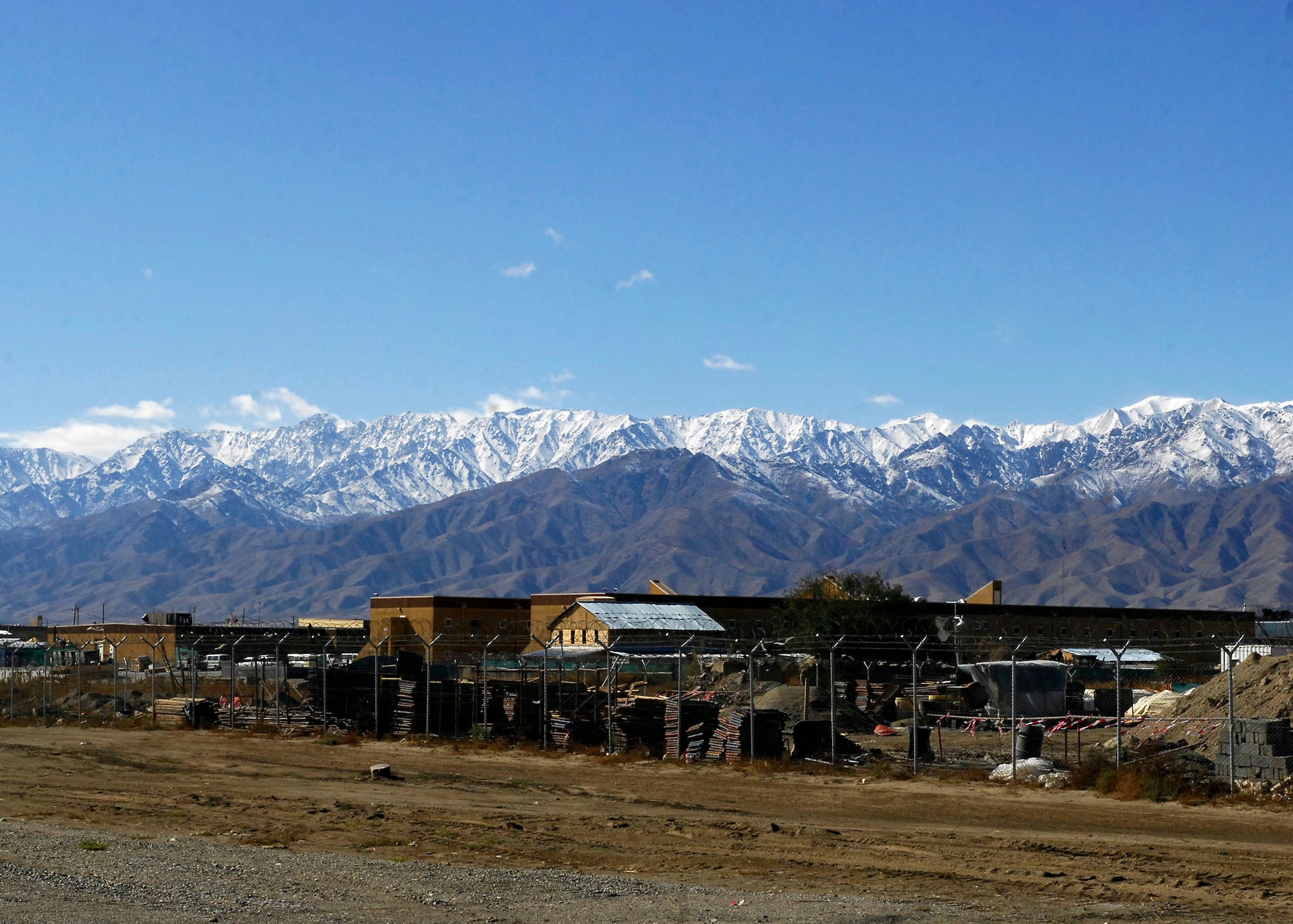 BAGRAM AIRFIELD, Afghanistan -- After a day of rain the beautiful Afghanistan mountains gleam in the sunlight Nov. 9, 2009.  The high altitude of the Hindu Kush mountain range creates a harsh climate ranging from more than 100 degrees Fahrenheit in the summer to below-freezing temperatures in the winter.  (U.S. Air Force photo/Senior Airman Felicia Juenke)