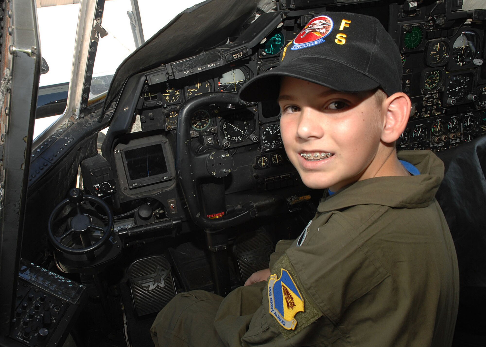 This month's Pilot for a Day participant, James Whipp, sits in the cockpit of a HC-130 here Oct. 10. As part of the program, James took a tour of the base and got to see several of the aircraft to include an HC-130 Hercules, an A-10 Thunderbolt and an HH-60 Pavehawk. (U.S. Air Force photo/Airman Jerilyn Quintanilla)