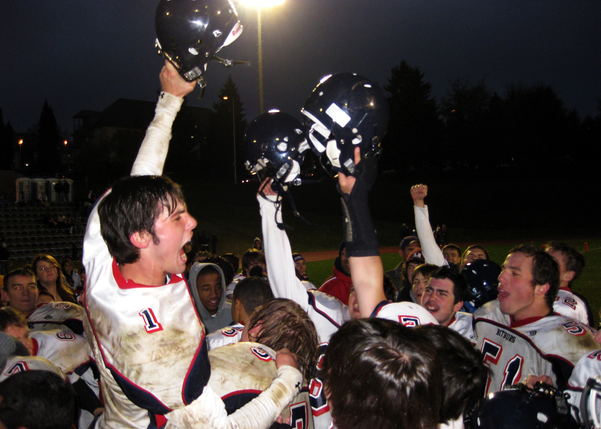 U.S. ARMY GARRISON BAUMHOLDER , Germany -- Bitburg senior Matthew Less leads his team in celebrating after winning the Department of Defense Dependents Schools-Europe Division II football championship game against the Ansbach Cougars Nov. 7. The Bitburg Barons defeated the Cougars 19-6 and ended the Cougars’ 31-game winning streak to claim the title as Division II champions. (U.S. Air Force photo/Master Sgt. Michael Garcia)