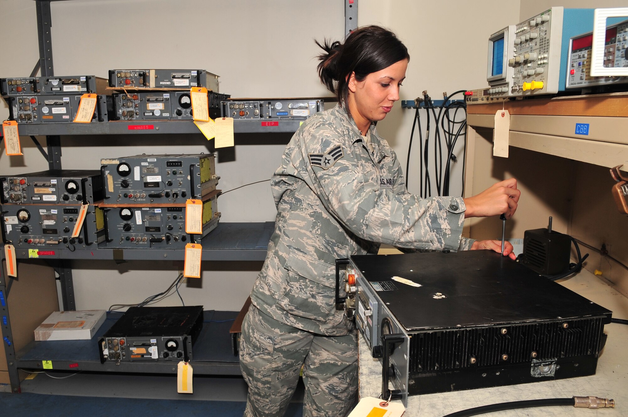 Senior Airman Tashia Kamper, 4th Communication Squadron airfield systems apprentice, closes a UHF transmitter box after completing an inspection on Seymour Johnson Air Force Base, N.C., Nov. 5, 2009. This equipment, located in the air traffic control tower, requires an annual inspection to check its serviceability. Airman Kamper is originally from St. Louis. (U.S. Air Force photo/Airman 1st Class Rae Perry)