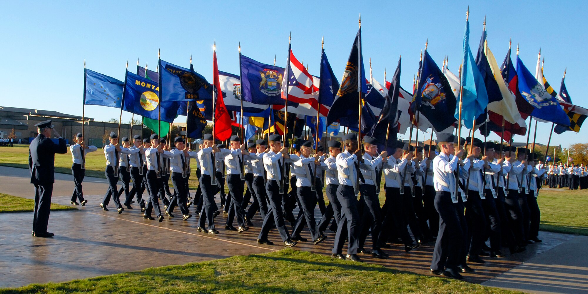 Brig. Gen. O.G. Mannon, left, commander of the 82nd Training Wing, renders a salute to the flags of the 50 United States during a parade Nov. 7 at the base parade grounds. 