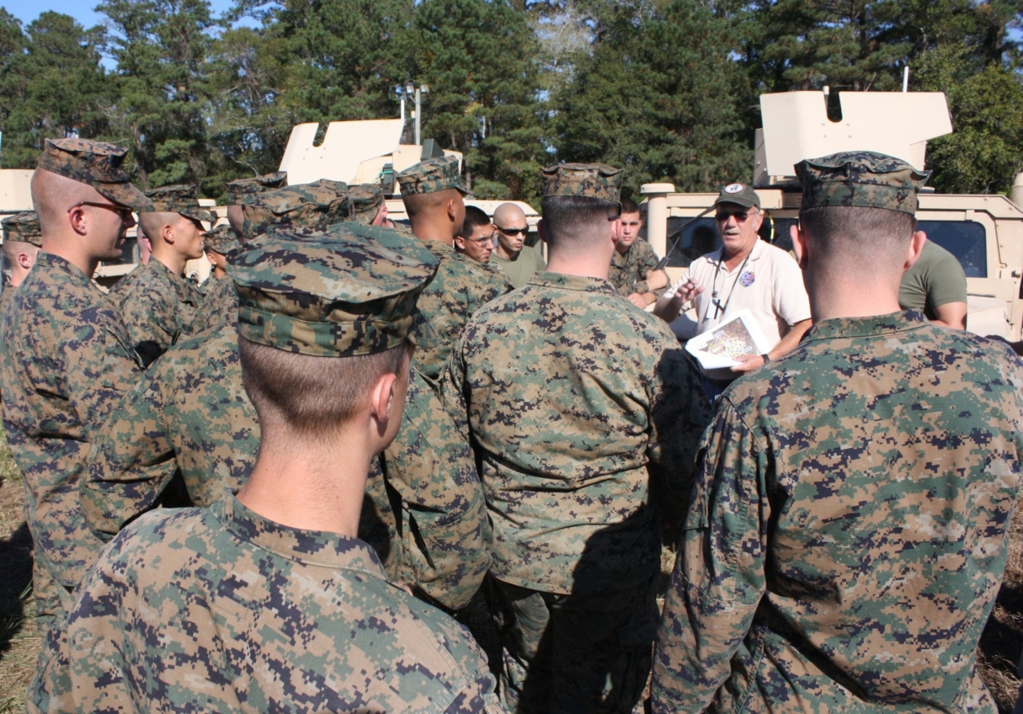 Mo Larkins, U.S. Joint Forces Command’s Joint Fires Integration and Interoperability Team analyst, briefs Marines before they move out to conduct tactical operations using new combat identification equipment during Bold Quest 09 at Camp Lejeune, N.C.  (U.S. Air Force photo by  Casey Bain)