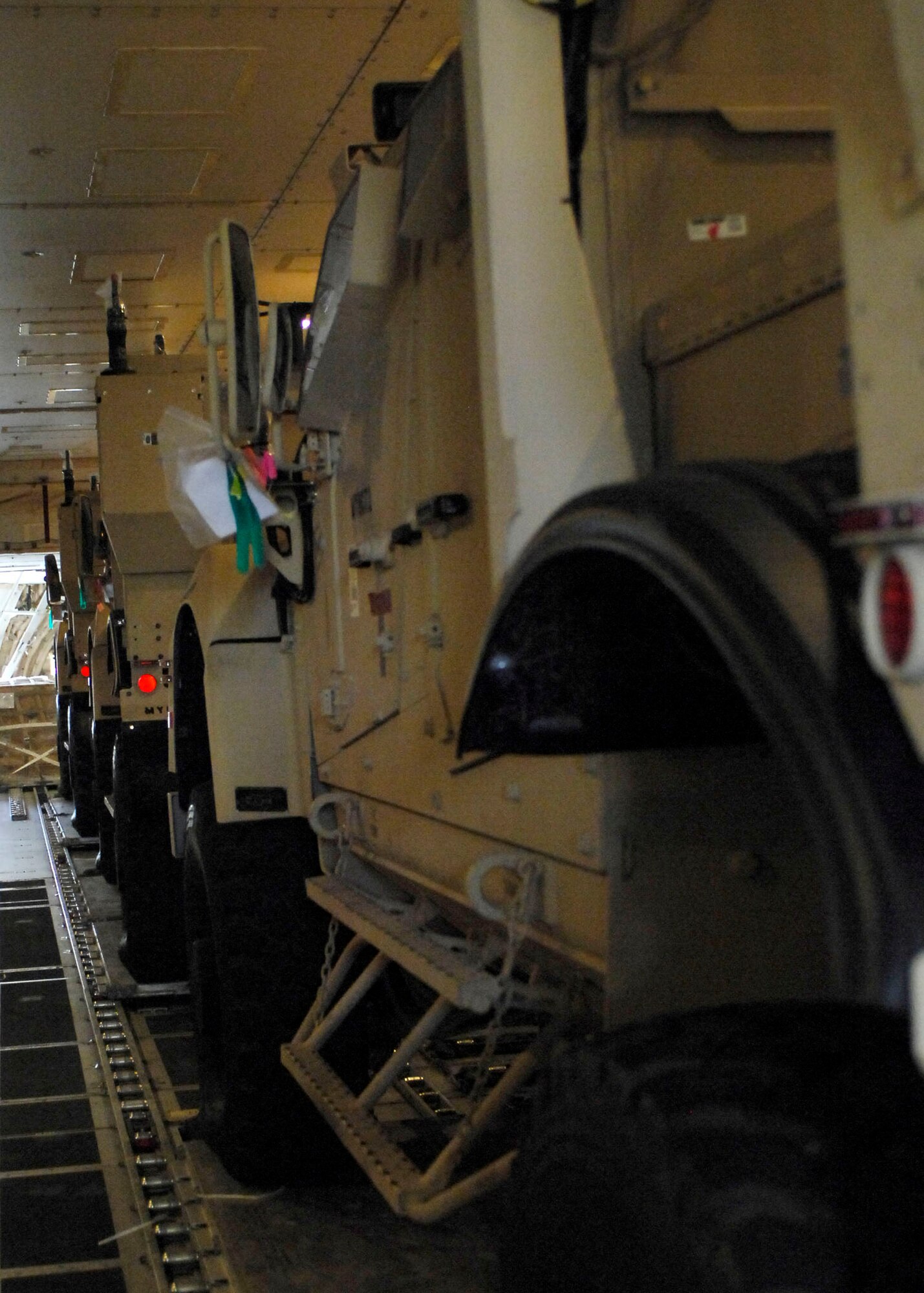 BAGRAM AIRFIELD, Afghanistan -- Multipurpose All Terrain Vehicles wait to be unloaded from a 747 Nov. 9, 2009.  The M-ATVs support mounted patrols, reconnaissance, security, convoy protection, communications, command and control, and combat service support. The M-ATV is designed to replace the up-armored Humvee in Afghanistan.  (U.S. Air Force photo/Senior Airman Felicia Juenke)