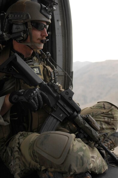 Staff Sgt. Stephen Skiano, a San Diego, Calif., native deployed with the 33rd Expeditionary Rescue Squadron here, gazes out on the Afghanistan terrain while heading out on a mission. Sergeant Skiano is a Pararescue Jumper and is deployed from Davis-Monthan Air Force Base, Ariz. PJs  are highly trained combat search and rescuemen; they go through 66 weeks of specialized training to become qualified for their job.  (U.S. Air Force photo/Senior Airman Susan Tracy)