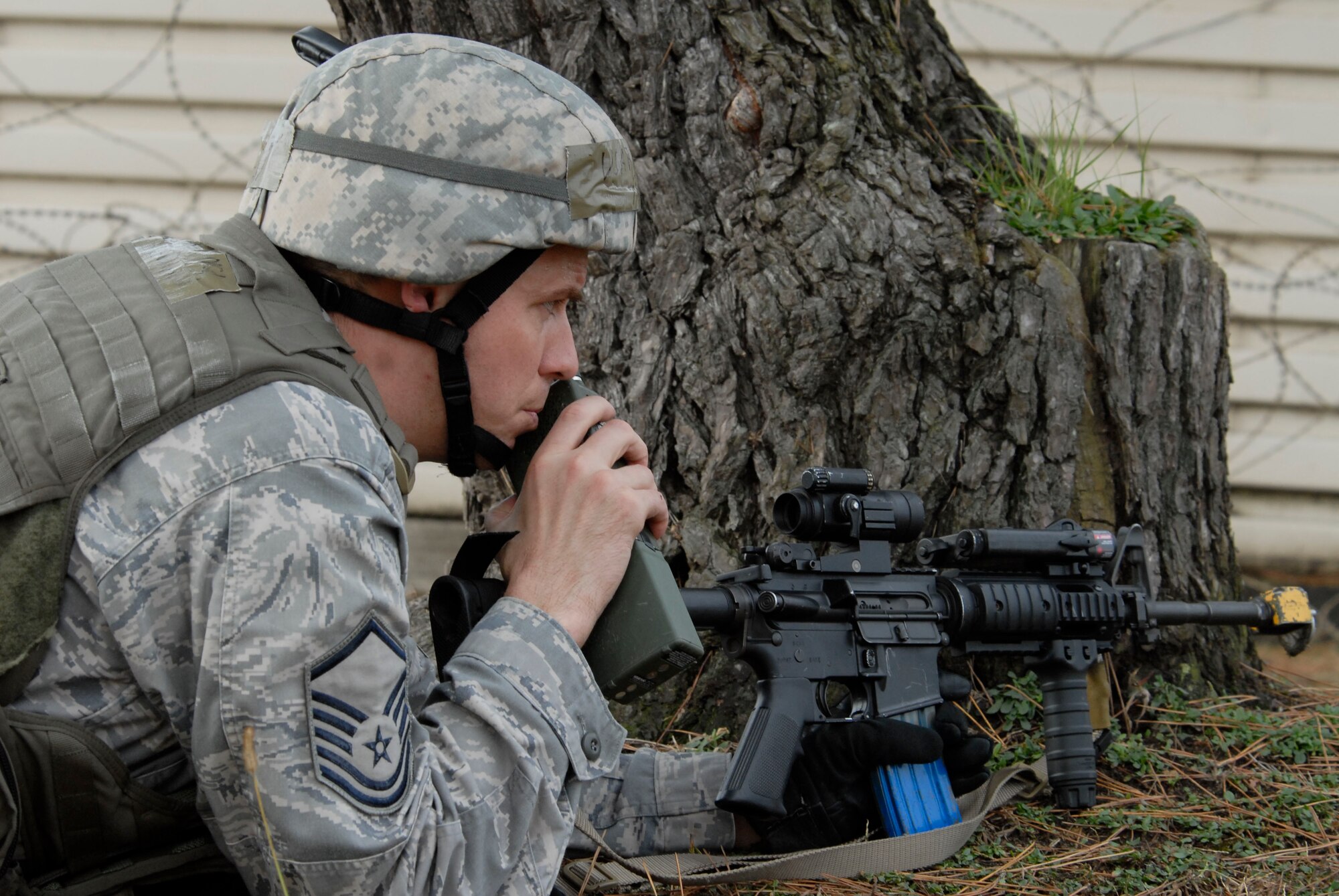 KUNSAN AIR BASE, Republic of Korea -- Master. Sgt. Todd Arend, 8th Security Forces Squadron, radios for back-up from his defensive position during Exercise Beverly Bulldog 0904 here Nov. 9. This scenario tested the 8 SFS ability to respond to a simulated attack. (U.S. Air Force photo/Staff Sgt. Darnell T. Cannady)