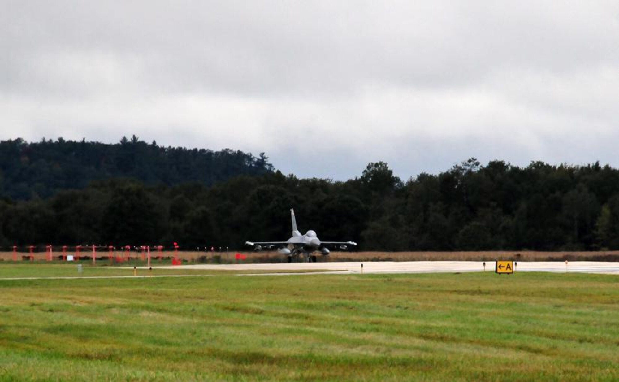 With a weight of 29,000 lbs. and at a speed of almost 110 MPH, Lt. Col. Nick Radney, a pilot with the115th Fighter Wing in Madison, Wis., gets ready to engage the Barrier Arresting Kit 12, a system designed to stop the aircraft in an emergency during an annual barrier certification at Volk Field, WI. Photo by Tech Sgt Kim Rodel, Volk Field CRTC.