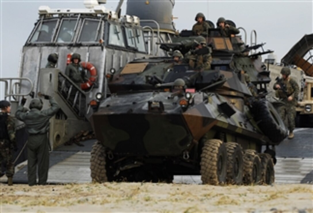 U.S. Marines assigned to the 31st Marine Expeditionary Unit unload assault vehicles from a landing craft, air cushion embarked on the amphibious dock landing ship USS Harpers Ferry (LSD 49) during a beach assault rehearsal at Hwajinri Beach in Pohang, Republic of Korea, on Nov. 4, 2009.  The Harpers Ferry is part of the USS Denver Amphibious Task Group, which along with the embarked 31st Marine Expeditionary Unit is conducting the annual bilateral Korean Integrated Training Program to maintain readiness and sustain the long-term security assistance relationship between the U.S. and Republic of Korea militaries.  