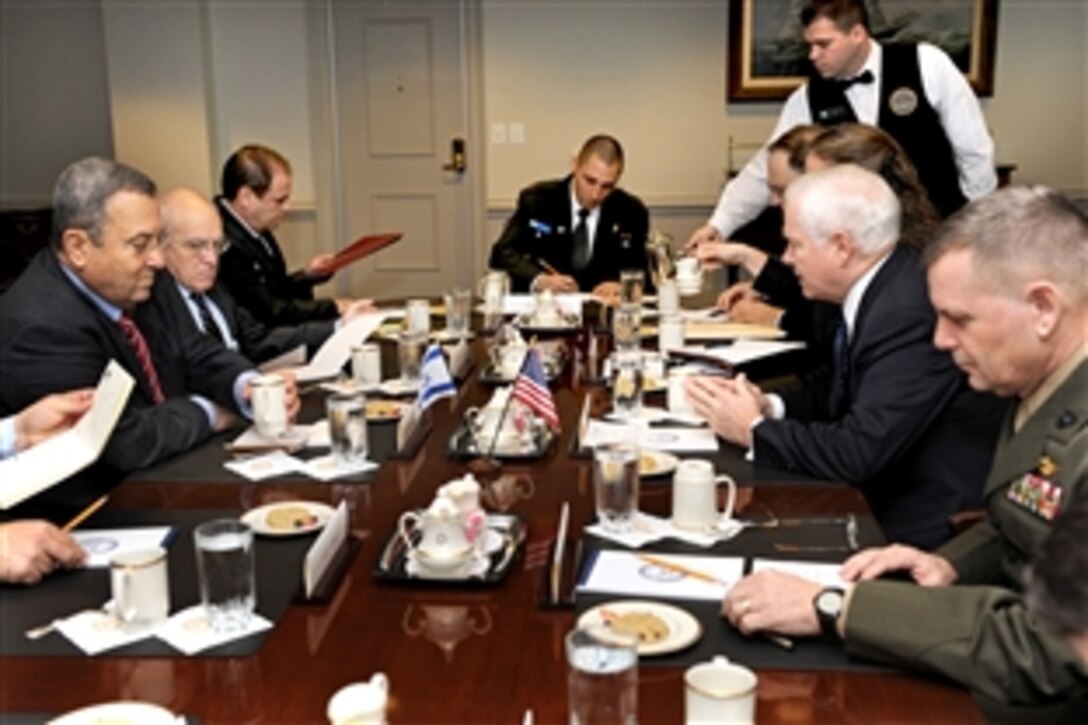 U.S. Defense Secretary Robert M. Gates, second from right, talks with Israeli Defense Minister Ehud Barak, left, about regional security issues during a meeting in the Pentagon, Nov. 9, 2009.