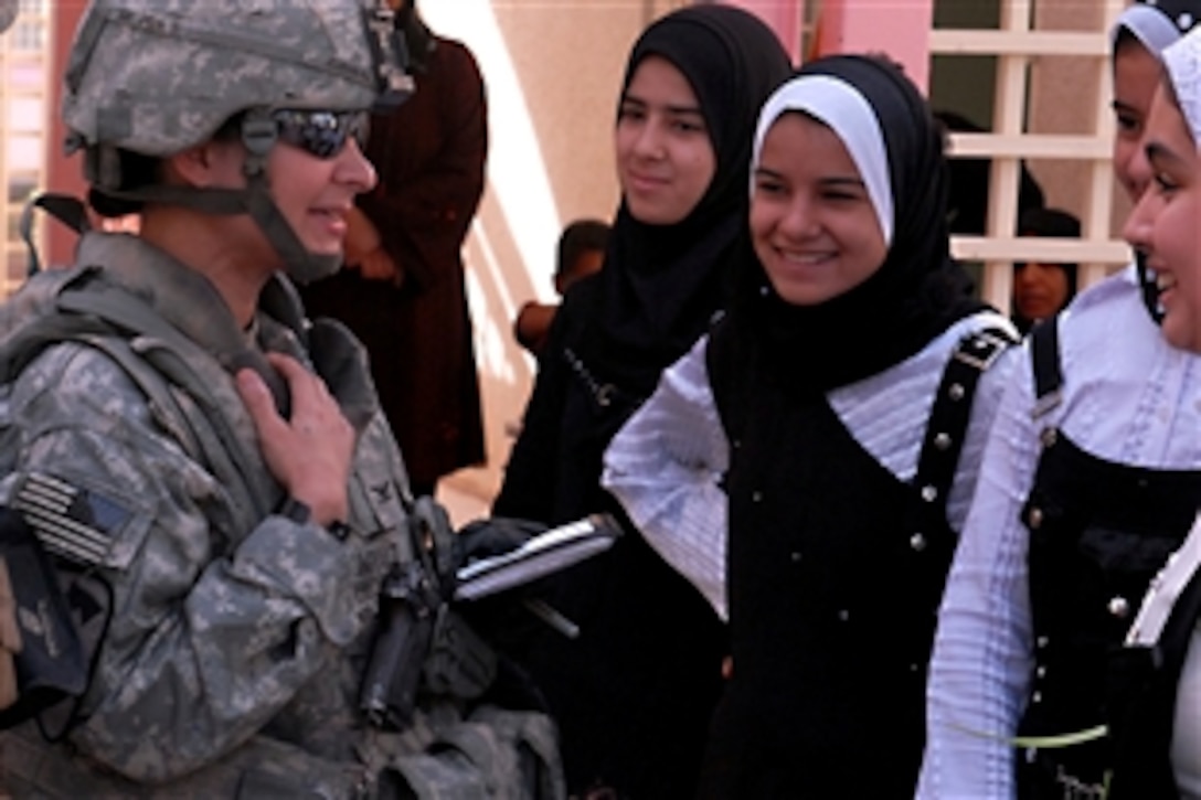 U.S. Army Col. Maria Zumwalt, left, chats with students of the Shab Female School, which was recently renovated by U.S. Army soldiers, Baghdad, Nov. 5, 2009. Zumwalt is the commander of the 1st Cavalry Division's Brigade Special Troops Battalion, 1st Brigade Combat Team.