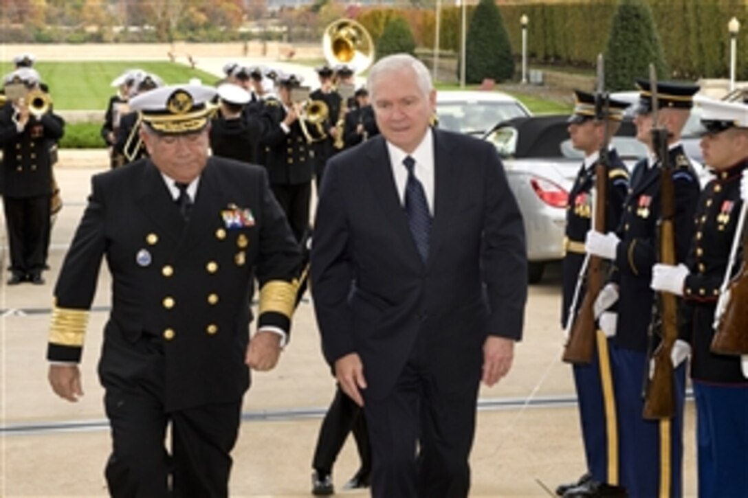 U.S. Defense Secretary Robert M. Gates, right, escorts Mexican Secretary of the Navy Adm. Mariano Francisco Saynez Mendoza, left, through an honor cordon upon his arrival at the Pentagon for bilateral security discussions, Nov. 9, 2009.  