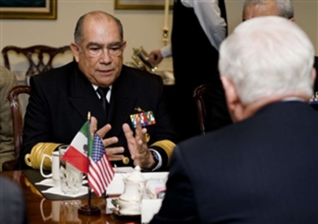 U.S. Defense Secretary Robert M. Gates, foreground, meets with Mexican Secretary of the Navy Adm. Mariano Francisco Saynez Mendoza, opposite, at the Pentagon, Nov. 9, 2009.  