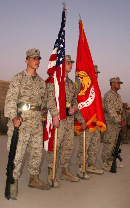 Combat Logistics Regiment 27 (Forward)’s color guard, stand at the position of parade rest during the 234th Marine Corps birthday cake-cutting ceremony aboard Camp Al Taqaddum, Iraq, Nov. 10, 2009.  Following the ceremony the Marines gathered to enjoy refreshments and camaraderie that Marines are known for.  (U.S. Marine Corps photograph by Lance Cpl. Melissa A. Latty)::r::::n::::r::::n:: ::r::::n::