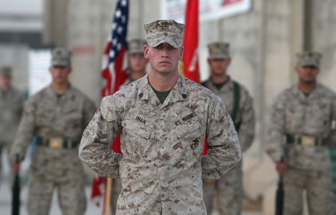 Sgt. James L. Iman, a data and wire technician with Communications Company, Combat Logistics Regiment 27 (Forward), stood in front of two company formations as the commander of troops during the 234th Marine Corps birthday ceremony held aboard Camp Al Taqaddum, Iraq, Nov. 10, 2009.  Following the ceremony the Marines gathered to enjoy refreshments and camaraderie that Marines are known for.  (U.S. Marine Corps photograph by Lance Cpl. Melissa A. Latty)