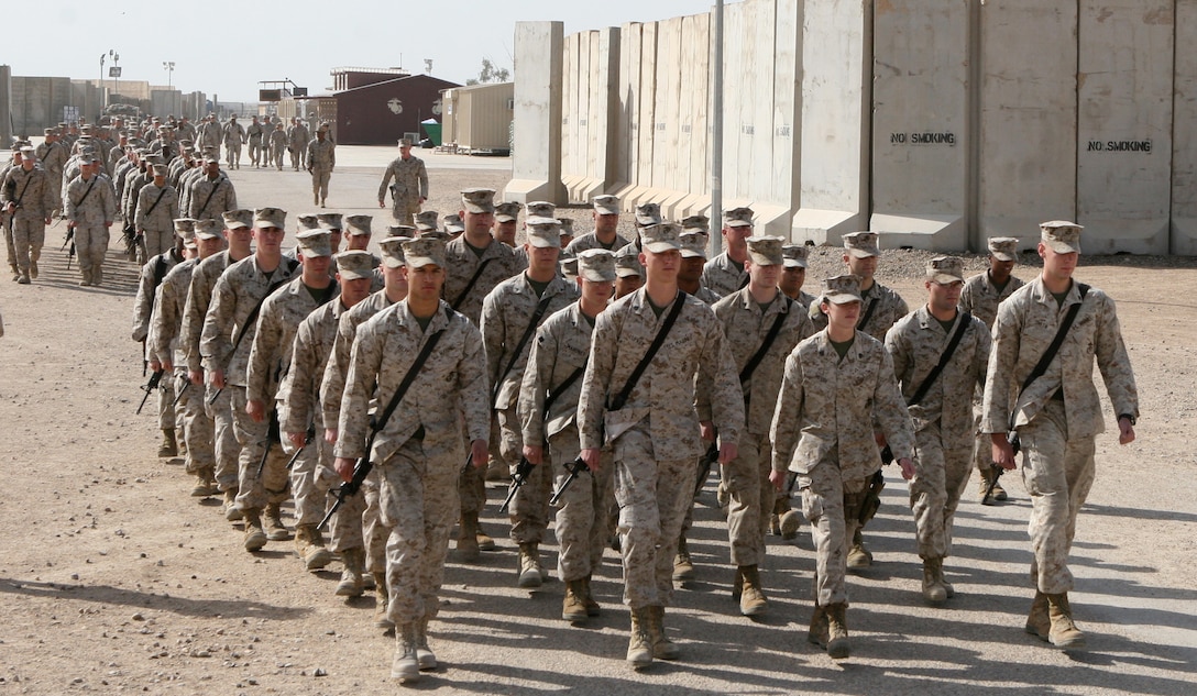 Marines with Combat Logistics Regiment 27 (Forward) marched to the dining facility where their leaders served a special lunch in celebration of the 234th Marine Corps birthday aboard Camp Al Taqaddum, Iraq, Nov. 10, 2009.  A cake-cutting ceremony was held later that night in front of the base’s version of the Tun Tavern aboard the base.  (U.S. Marine Corps photograph by Gunnery Sgt. Katesha R. Washington)