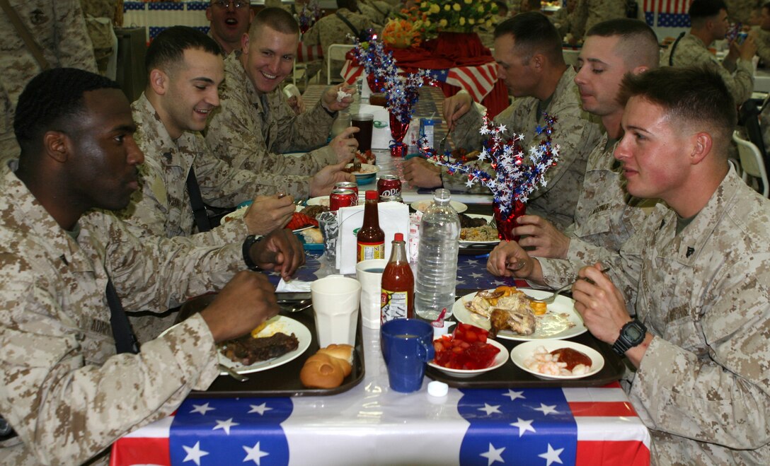 Marines with Combat Logistics Regiment 27 (Forward), enjoy a celebratory lunch in honor of the 234th Marine Corps birthday at the dining facility aboard Camp Al Taqaddum, Iraq, Nov. 10, 2009.  A cake-cutting ceremony was held later that night in front of the base’s version of the Tun Tavern aboard the base.  (U.S. Marine Corps photograph by Gunnery Sgt. Katesha R. Washington)