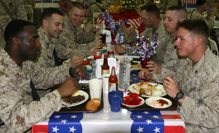 Marines with Combat Logistics Regiment 27 (Forward), enjoy a celebratory lunch in honor of the 234th Marine Corps birthday at the dining facility aboard Camp Al Taqaddum, Iraq, Nov. 10, 2009.  A cake-cutting ceremony was held later that night in front of the base’s version of the Tun Tavern aboard the base.  (U.S. Marine Corps photograph by Gunnery Sgt. Katesha R. Washington)