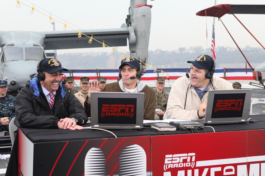 From left to right, Sal Paolantonio, Mike Greenberg and Mike Golic have a laugh during the live broadcast of the “ Mike and Mike In The Morning” show  aboard USS New York in New York City Nov. 10, 2009. Aboard USS New York was Special Purpose Marine Air Ground Task Force 26, which was formed to support the commissioning of USS New York.