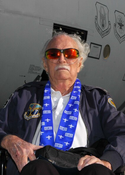 Air Force Col. (ret.) Mac Vickrey shows off the 302nd Airlift Wing's flying scarf Nov. 10 after meeting members of the unit and seeing one of the Air Force Reserve C-130 Hercules aircraft at Peterson Air Force Base, Colo. The 90-year-old Colonel Vickrey entered the U.S. Army in 1942, after being drafted in support of World War II. After joining, the colonel signed up for pilot training and served in the Army Air Force, then later the U.S. Air Force until 1973. During his career, he accumulated more than 15,000 flying hours on various aircraft, flew precious supplies to beleagured West Berliners during the 1948 Berlin Airlift, was tasked with running a Vietnamese base in support of the Vietnam War and flew the first airborne command and control aircraft for the Air Force: the EC-121. Colonel Vickrey also met with aircrew and senior enlisted leaders of the 302nd AW. (U.S. Air Force photo/Staff Sgt. Stephen J. Collier)