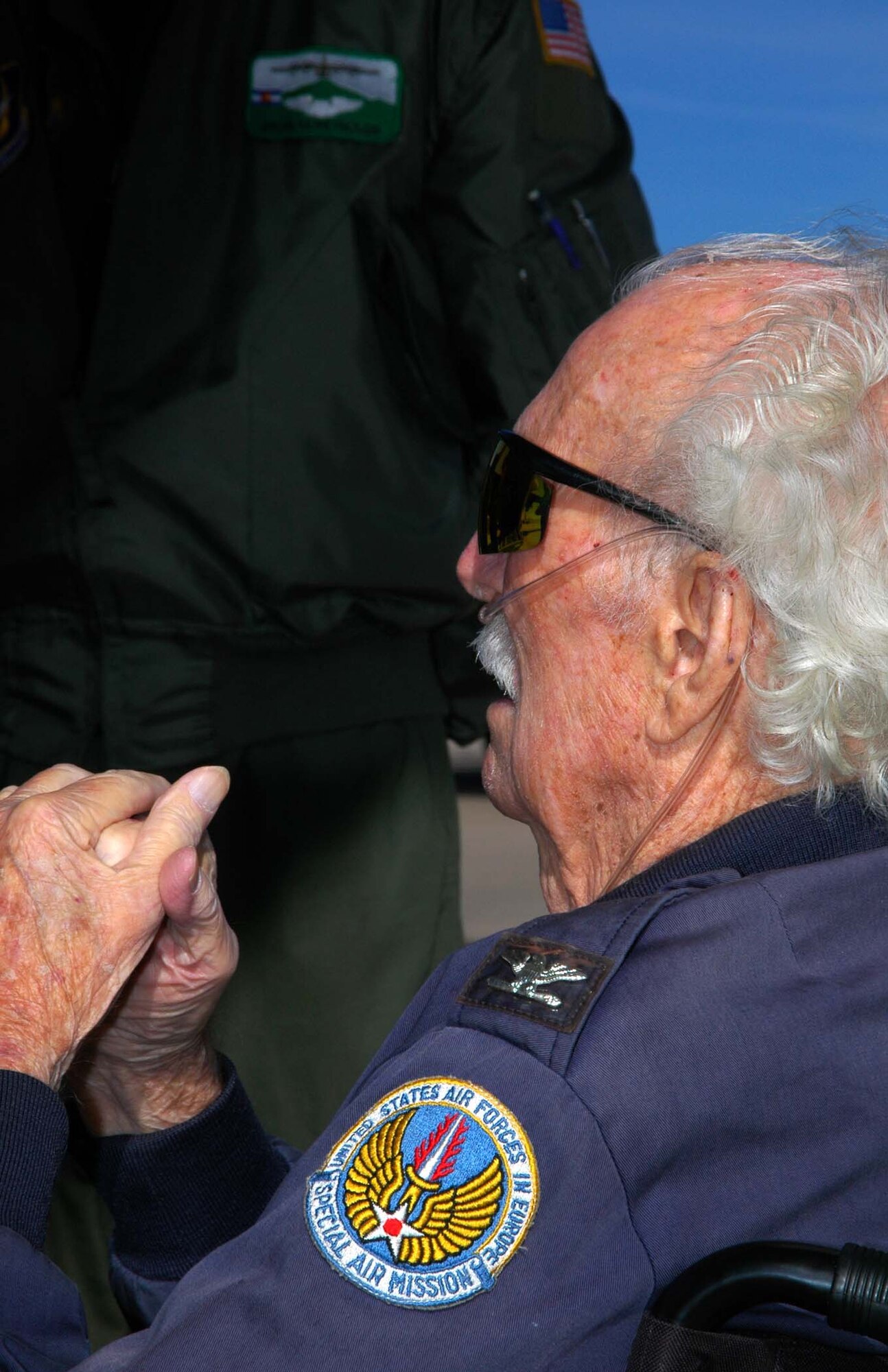 Air Force Col. (ret.) Mac Vickrey tells tales of his days of flying supplies to Germans caught behind a Soviet blockade of West Berlin during the 1948 Berlin Airlift Nov. 10 at Peterson Air Force Base, Colo. The 90-year-old Colonel Vickrey visited the base's 302nd Airlift Wing, Air Force Reserve Command, and aircrew members, seeing the wing's C-130 Hercules up close. The colonel entered the U.S. Army in 1942, after being drafted in support of World War II. After joining, the colonel signed up for pilot training and served in the Army Air Force, then later the U.S. Air Force until 1973. During his career, he accumulated more than 15,000 flying hours on various aircraft, flew precious supplies to beleagured West Berliners during the 1948 Berlin Airlift, was tasked with running a Vietnamese base in support of the Vietnam War and flew the first airborne command and control aircraft for the Air Force: the EC-121. (U.S. Air Force photo/Staff Sgt. Stephen J. Collier)