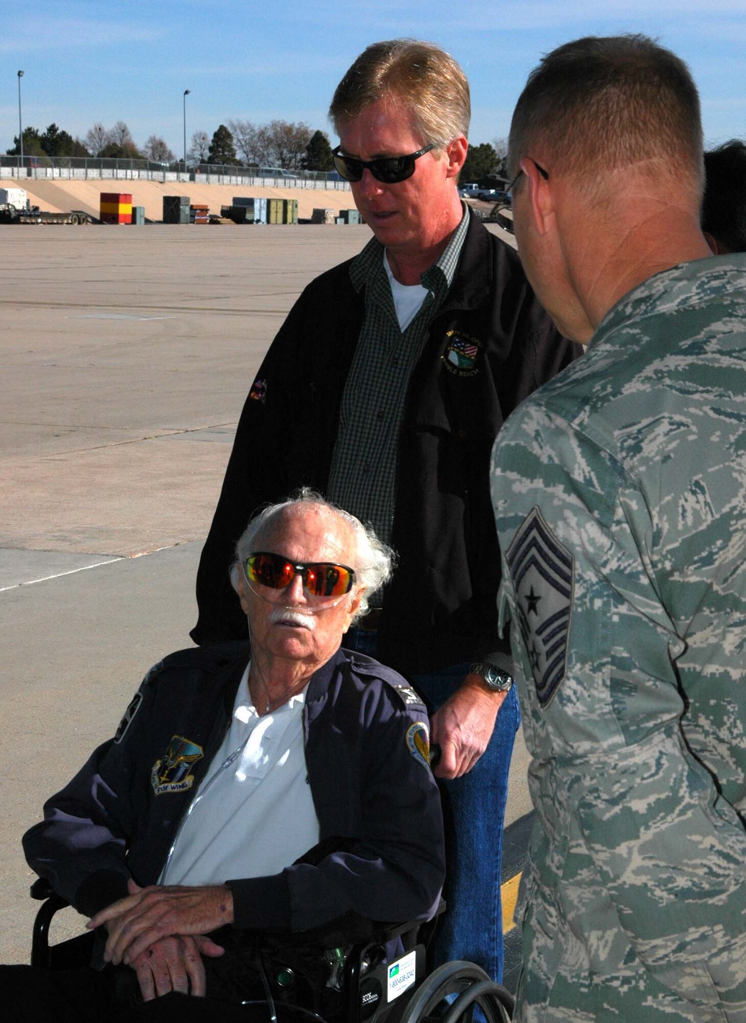 Air Force Col. (ret.) Mac Vickrey talks with Chief Master Sgt. Joseph Westerlund Nov. 10 during a visit to the Air Force Reserve's 302nd Airlift Wing to see one of the unit's C-130 Hercules aircraft at Peterson Air Force Base, Colo. The 90-year-old Colonel Vickrey entered the U.S. Army in 1942, after being drafted in support of World War II. After joining, the colonel signed up for pilot training and served in the Army Air Force, then later the U.S. Air Force until 1973. During his career, he accumulated more than 15,000 flying hours on various aircraft, flew precious supplies to beleagured West Berliners during the 1948 Berlin Airlift, was tasked with running a Vietnamese base in support of the Vietnam War and flew the first airborne command and control aircraft for the Air Force: the EC-121. Colonel Vickrey also met with aircrew and senior enlisted leaders of the 302nd AW. Chief Westerlund is the 302nd AW's command chief. (U.S. Air Force photo/Staff Sgt. Stephen J. Collier)