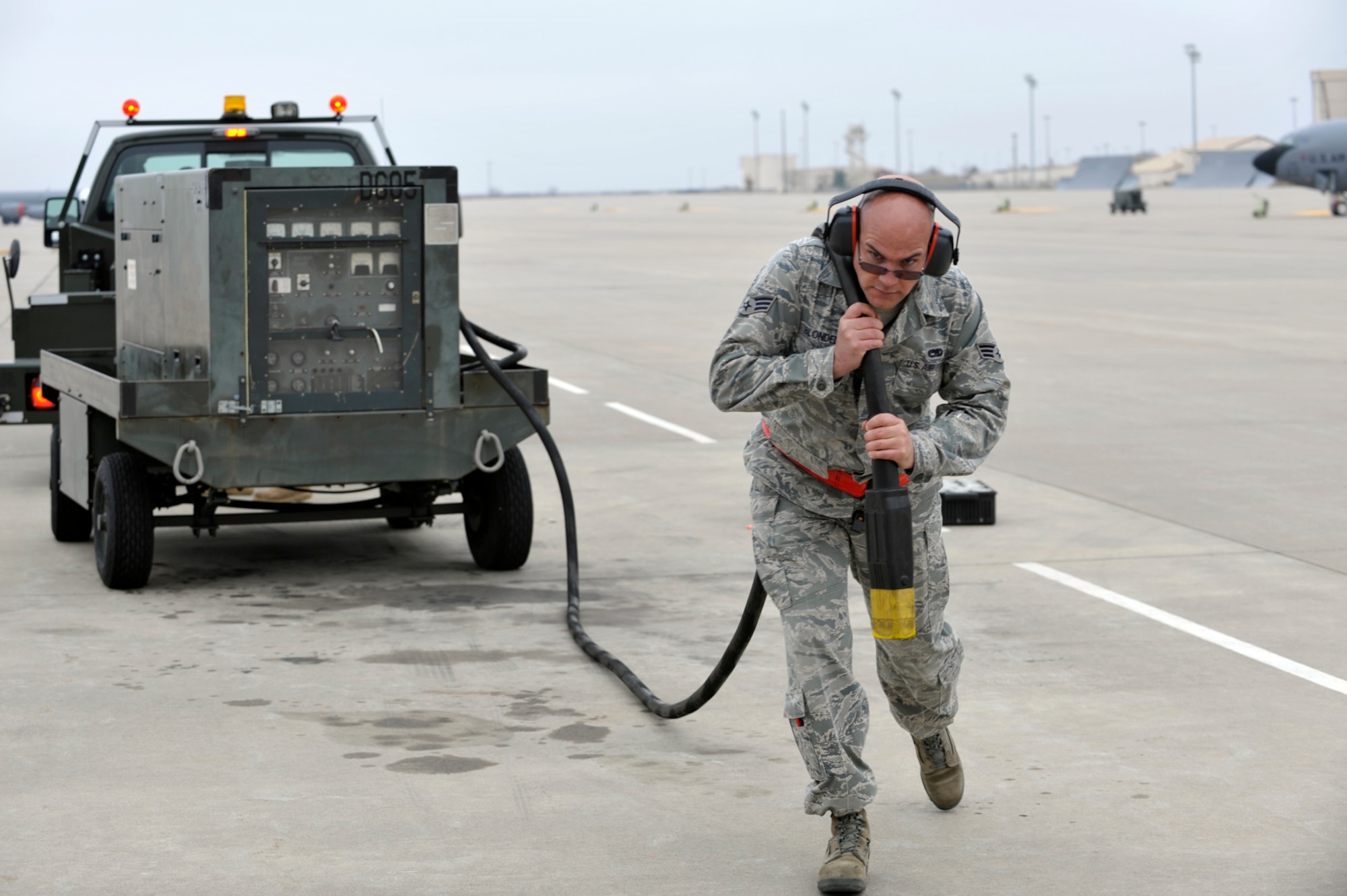Senior Airman Daniel Blondell carries a power cable to a KC-135 Stratotanker on the flightline here on Nov. 10, 2009, the same day as the 234th birthday of the U.S. Marine Corps. Airman Blondell was an active-duty Marine before joining the Air Force Reserve. Celebrating the birth of the Corps is one of the proudest traditions for current and former Marines. The secretary and chief of staff of the Air Force sent birthday messages to the Marine Corps Tuesday. (U.S. Air Force photo/Master Sgt. Jason Schaap)