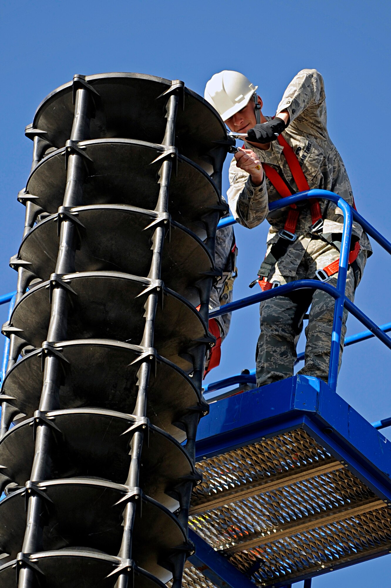 ELLSWORTH AIR FORCE BASE, S.D. -- Airman 1st Class Austin Bass, 28th Communications Squadron ground radio technician, unscrews the cover of a speaker system, Nov. 6. Airman Bass is working on repairing a speaker driver on a speaker used for playing taps, reveille, retreat and warnings. (U.S. Air Force photo/Airman 1st Class Matthew Flynn)