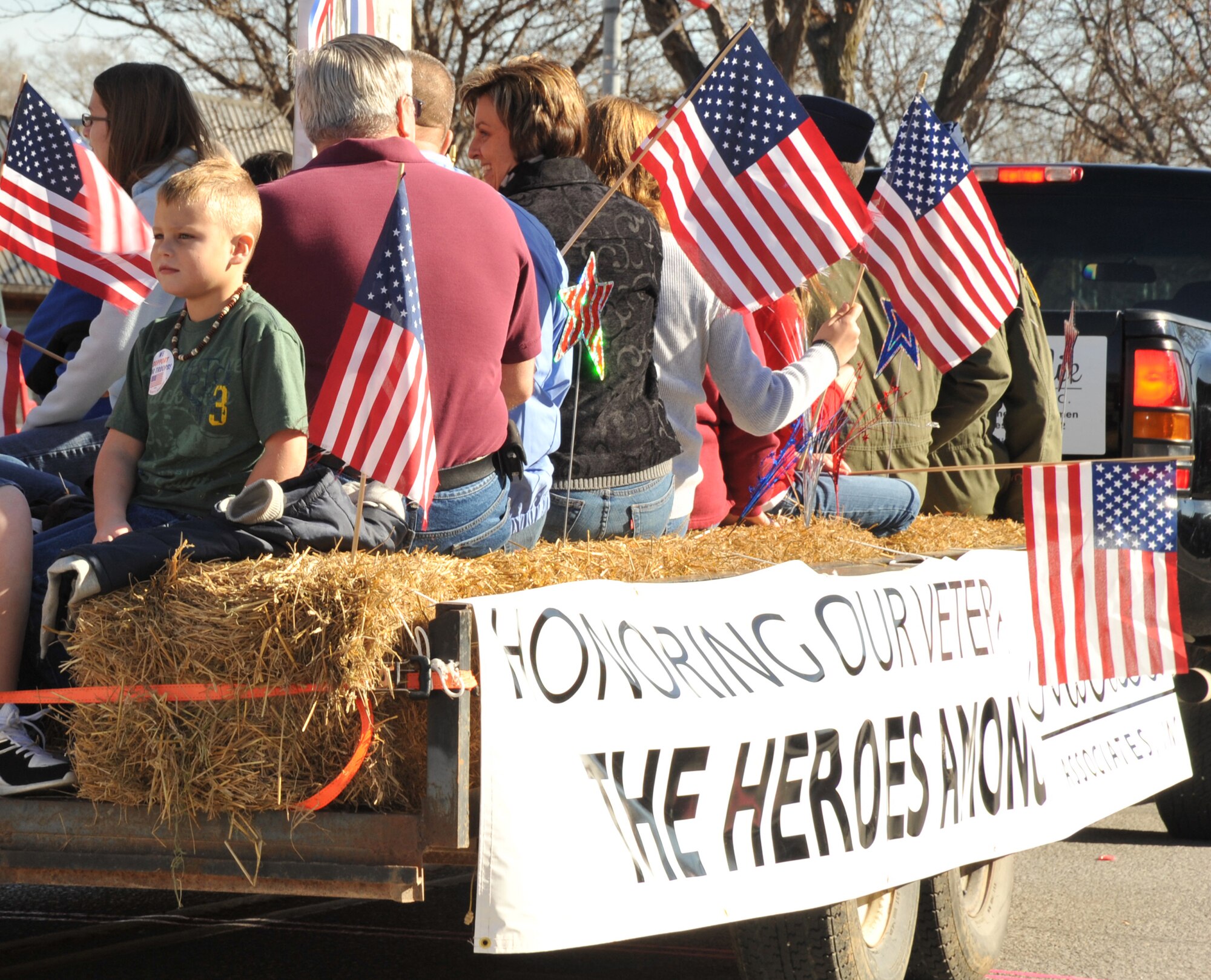 OFFUTT AIR FORCE BASE, Neb. - Children and parents of the Offutt and Bellevue community ride a float down historic Mission Avenue in Old Towne Bellevue, Neb., during the Annual Official Veterans Parade Nov. 7. The parade, in its 10th year, honors the service and sacrifices of all military veterans and their family members. 
U.S. Air Force photo by D.P. Heard