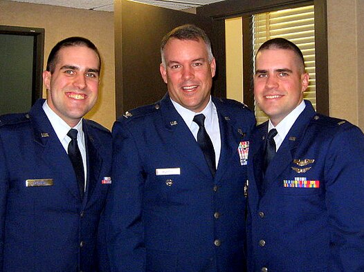 Identical twin brothers 1st Lts. Andrew (left) and Jared (right) Scherff stand next to fellow "Buckeye" and graduate of The Ohio State University, Col. Richard Murphy, 71st Flying Training Wing vice commander. (Courtesy photo)