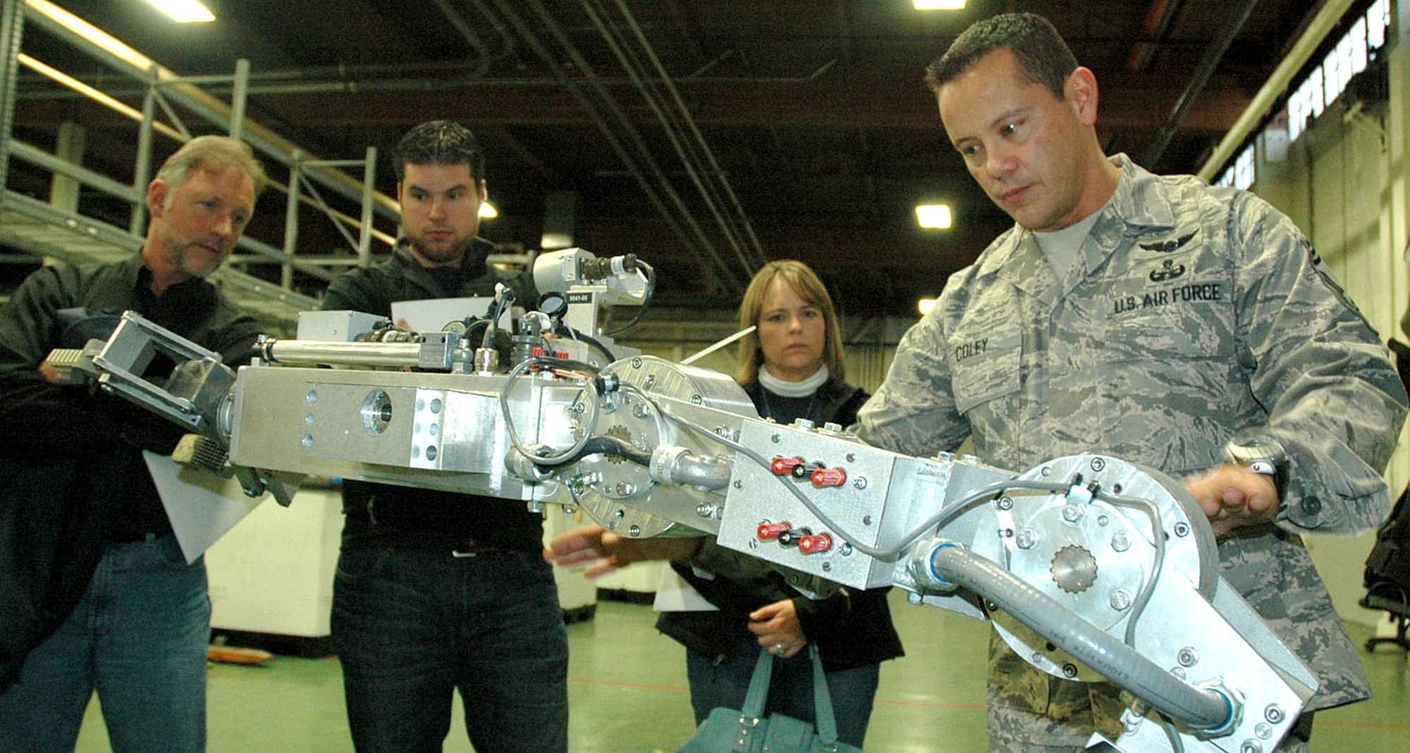 Chief Master Sgt. James "Mitch" Coley, 446th Civil Engineer Squadron Explosive Ordnance Disposal Flight, shows civilian employers of Reservists how the Remotec robot works, during the 446th Airlift Wing Employer Orientation Day, Nov. 7 here. (U.S. Air Force photo/Staff Sgt. Nicole Celestine)