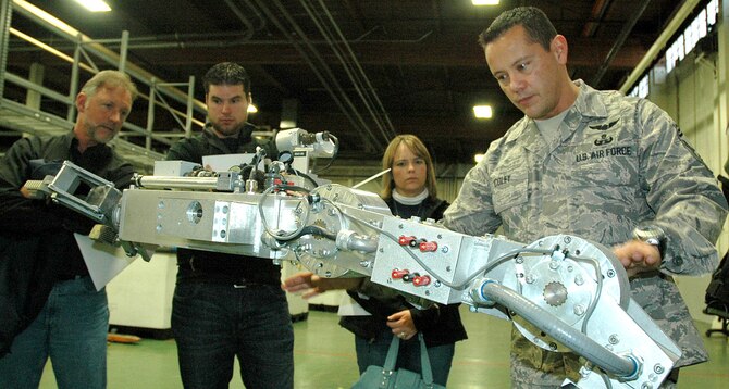 MCCHORD AIR FORCE BASE, Wash., - Chief Master Sgt. James "Mitch" Coley, 446th Civil Engineer Squadron Explosive Ordnance Disposal Flight, shows civilian employers of Reservists how the Remotec robot works, during the 446th Airlift Wing Employer Orientation Day, Nov. 7 here. (U.S. Air Force photo/Staff Sgt. Nicole Celestine) 