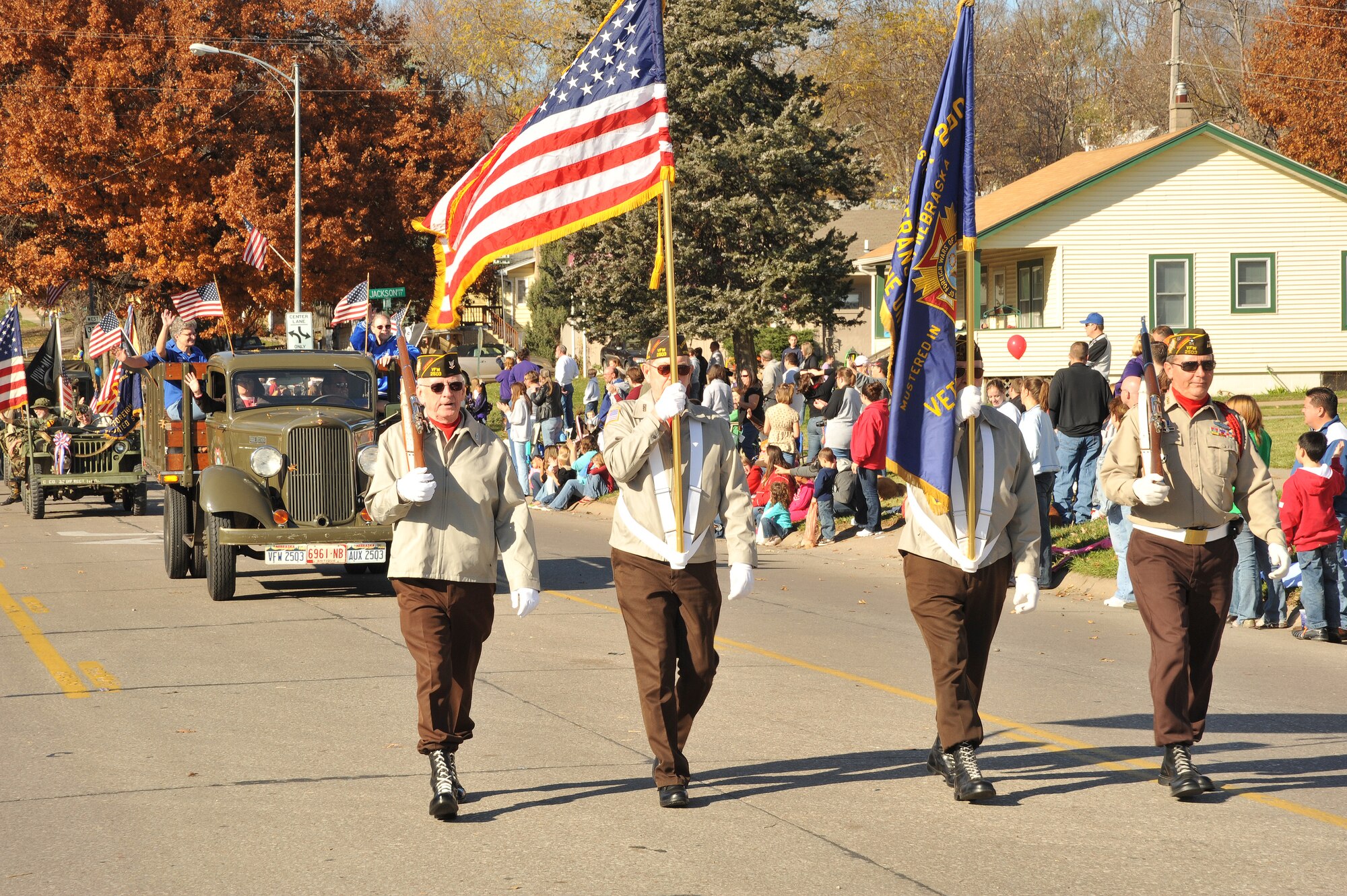 OFFUTT AIR FORCE BASE, Neb. - Members of Nebraska Veterans of Foreign Wars Chapter 2503, march down Mission Avenue in Olde Towne Bellevue, Neb.,  during the Official Nebraska Veterans Parade Nov. 7. The parade, in its 10th year, honors all military veterans and their family members for their service and sacrifices. 
U.S. Air Force photo by D.P. Heard