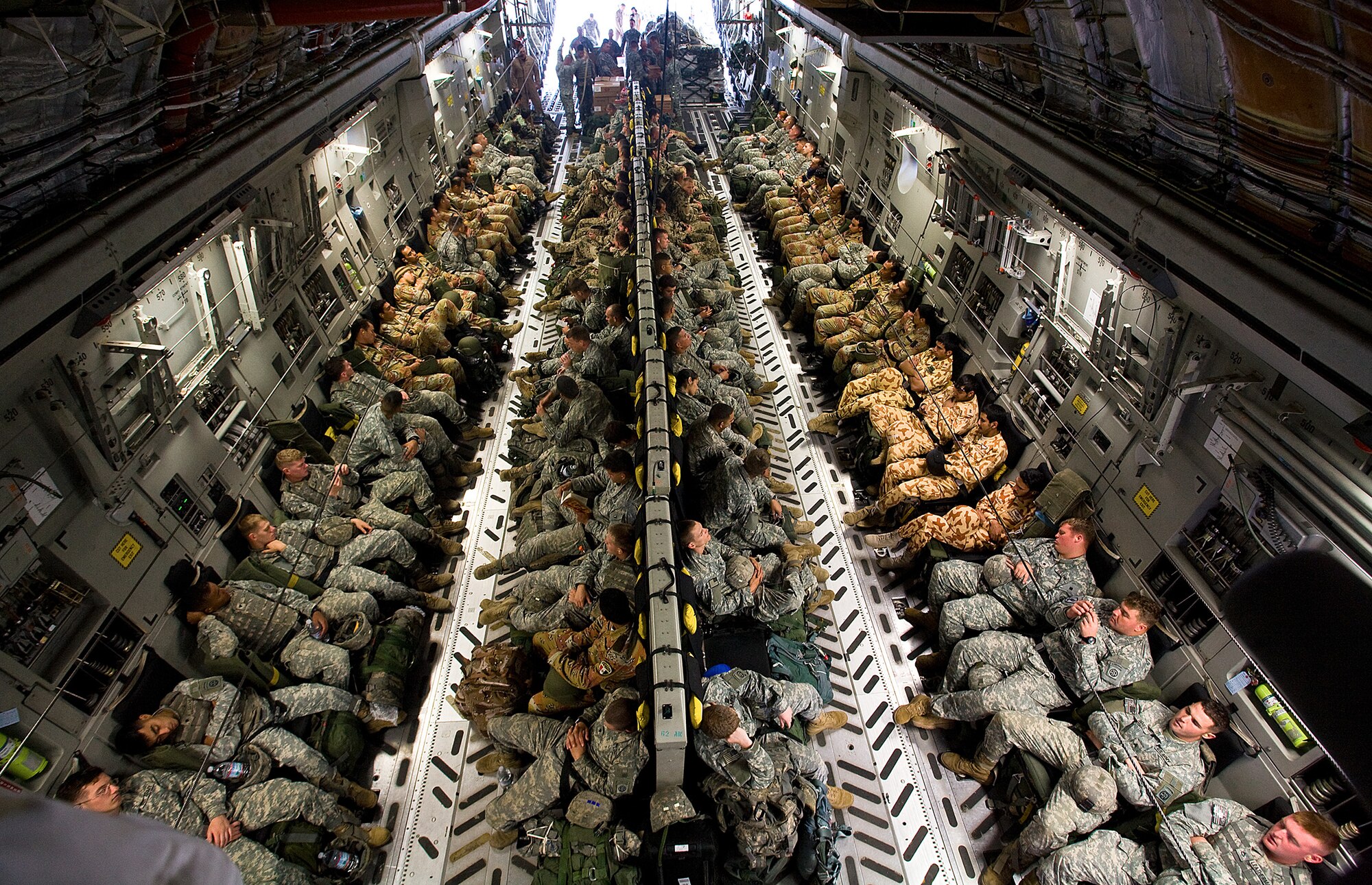 One-hundred U.S., Egyptian, Pakistani, Kuwaiti and German soldiers prepare to a non-stop, 15-hour flight  from Pope AFB, N.C., to Egypt as part of the Bright Star Exercise Oct. 11. (U.S. Air Force photo/Col. Joseph Mancy)