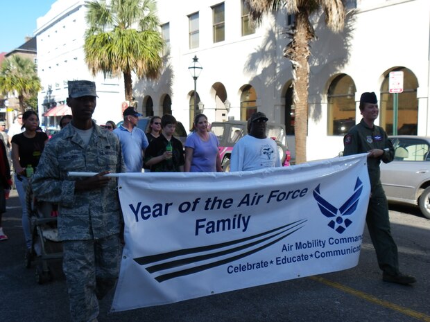 Senior Airman John Mitchell and Senior Master Sgt. Jeanette King carry the Year of the Air Force Family banner during the during Charleston's Annual Tri-County Veteran’s Day Parade Oct. 8 in downtown Charleston. Airman Mitchell is a member of the 437th Force Support Squadron and Sergeant King is a member of the 15th Airlift Squadron. (U.S. Air Force photo by Senior Master Sgt. Walter Bonner Jr.) 