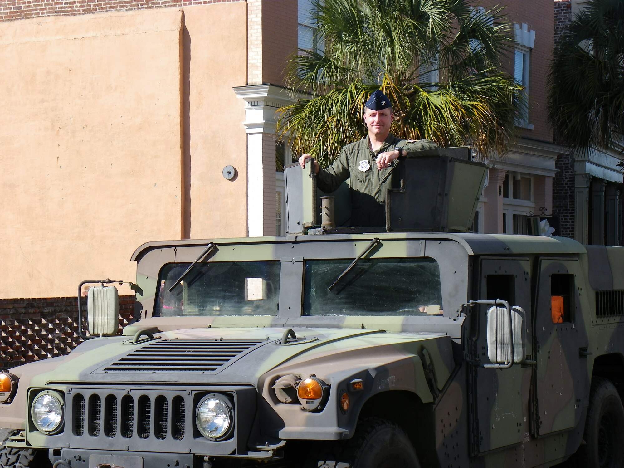 Col. John Wood rides in a Humvee during the 12th Annual Tri-County Veterans Day parade Oct. 8 in downtown Charleston. Colonel Wood is the 437th Airlift Wing commander. (U.S. Air Force photo/Senior Master Sgt. Walter Bonner Jr.)   

