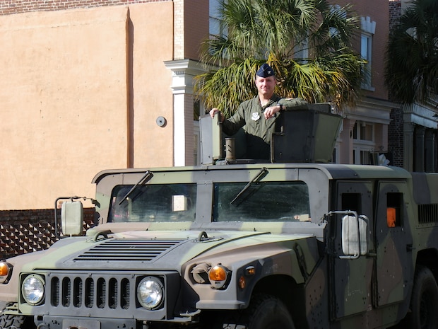 Col. John Wood rides in a Humvee during the 12th Annual Tri-County Veterans Day parade Oct. 8 in downtown Charleston. Colonel Wood is the 437th Airlift Wing commander. (U.S. Air Force photo/Senior Master Sgt. Walter Bonner Jr.)   

