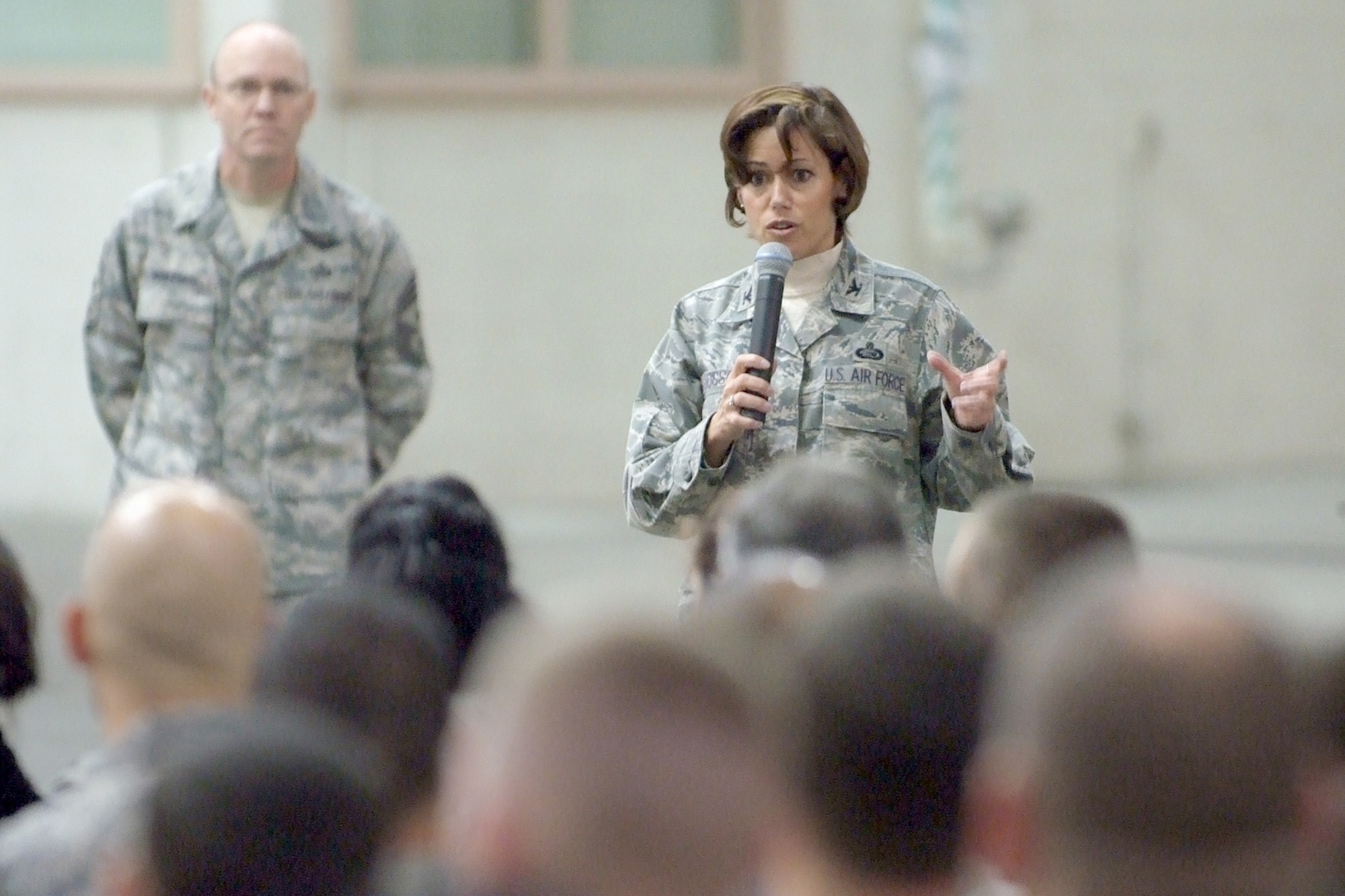 Col. Gina Grosso, Joint Base McGuire-Dix-Lakehurst commander, addresses the Airmen of the 87th Air Base Wing during the opening ceremony of Wingman Day, Nov. 10 here. Colonel Grosso and Command Chief Master Sgt. Warren Wofford explained the importance the wingman concept and the significance of Wingman Day. (U.S. Air Force photo/Russ Meseroll).
