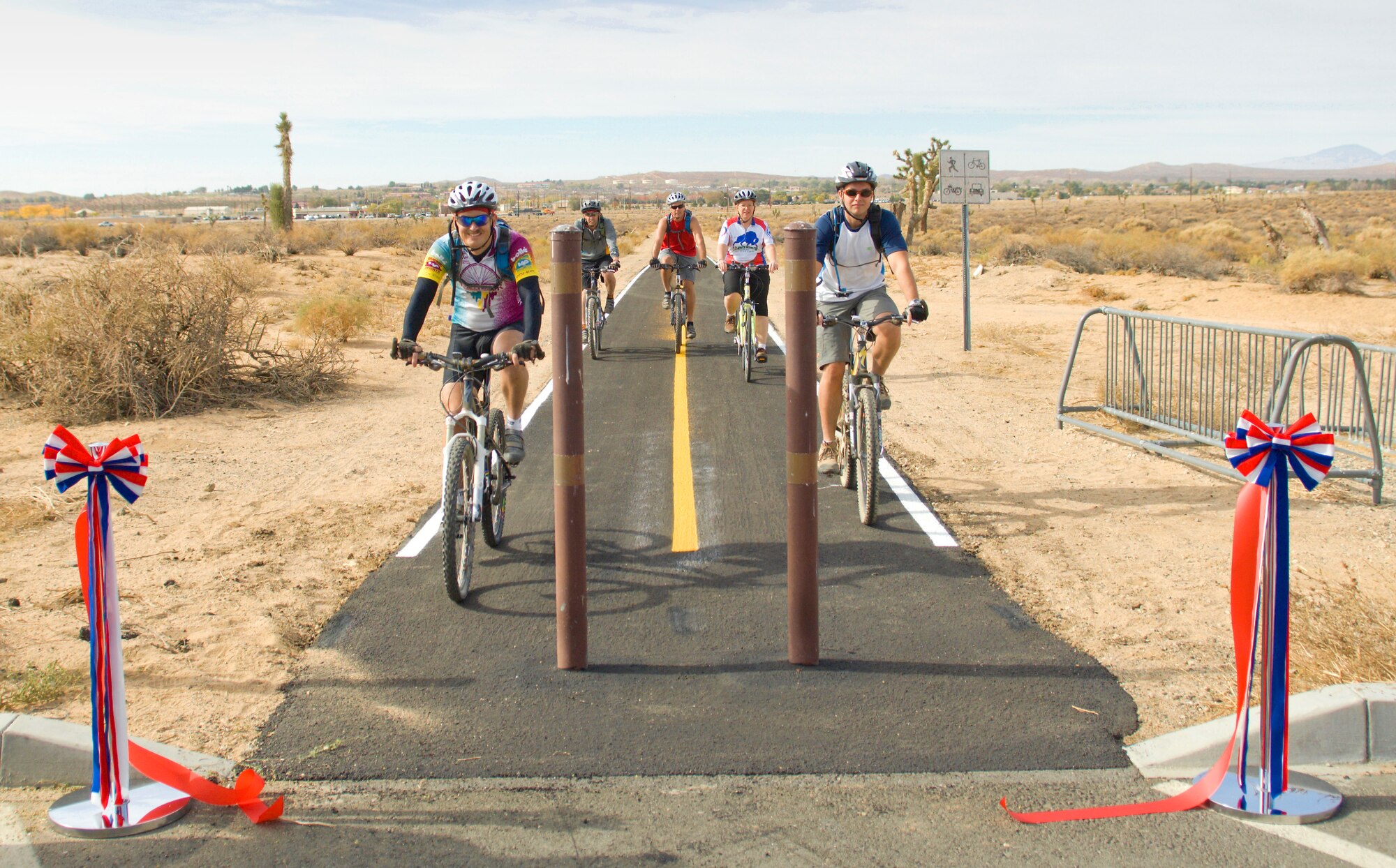 Bikers use the bike/run path behind the Rosburg Fitness Center following a ribbon-cutting ceremony Nov. 9.The path, which was closed to be refurbished, officially reopened Nov. 9. (Air Force photo/Mike Cassidy)