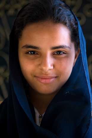 Anna, an Egyptian carpet weaver, wears a hijab, a traditional head scarf, in a villiage south of Cairo, Egypt Oct. 18. (U.S. Air Force photo/Col. Joseph Mancy)